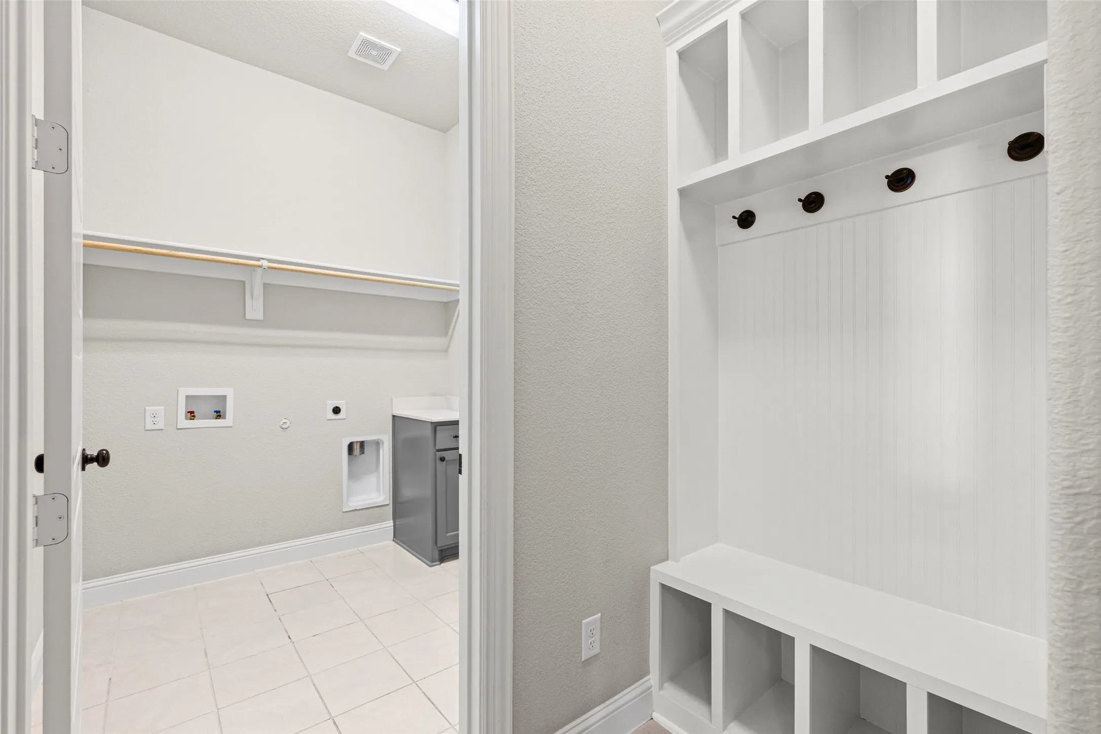 Mudroom is by the laundry room which connects to one of the primary closets.