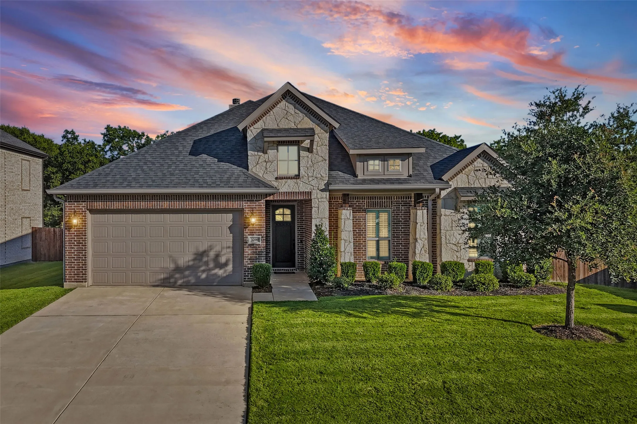 Great curb appeal with only one next door neighbor and green space behind