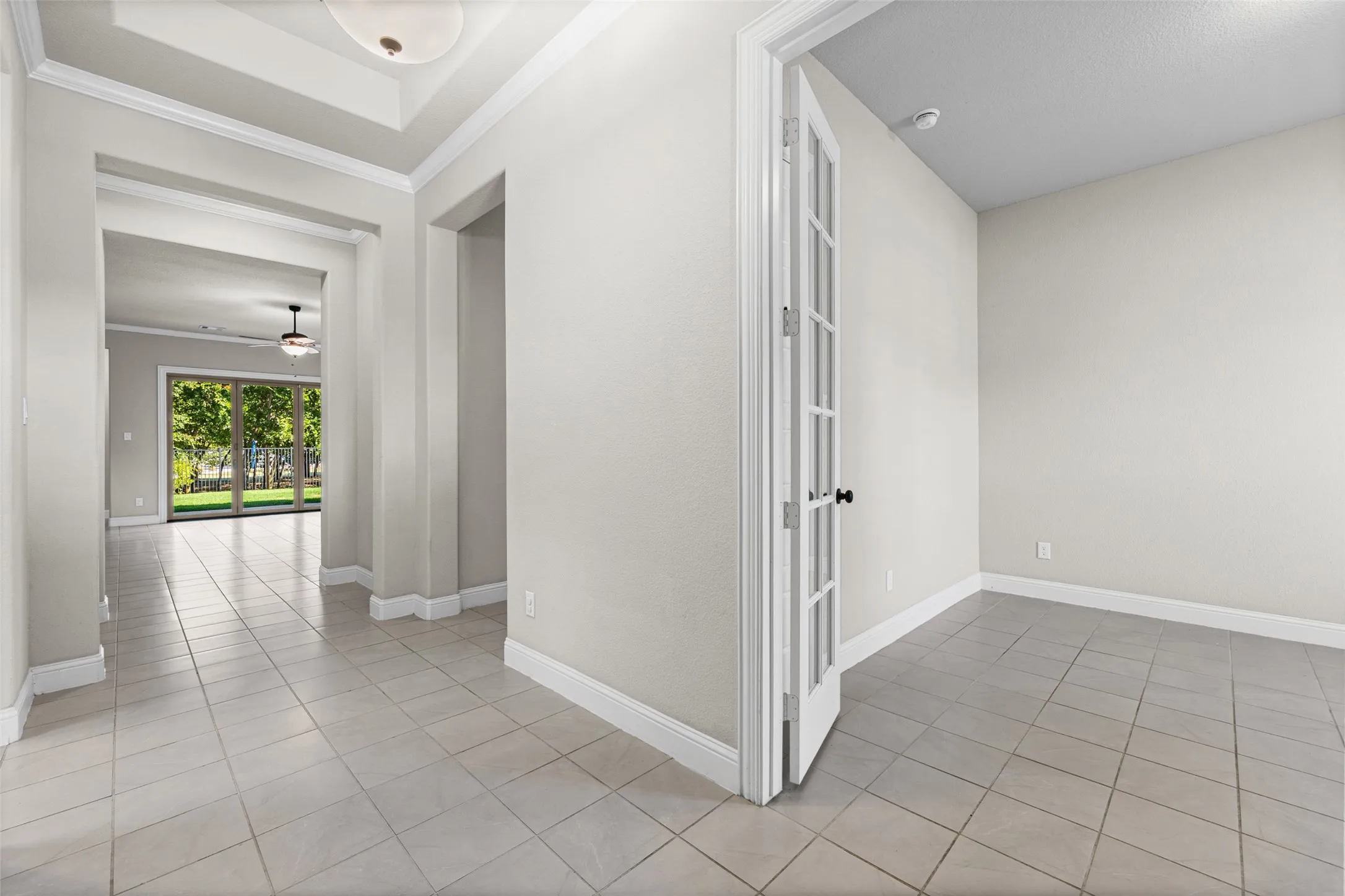 View from the front door into the living room and the office or 4th bedroom at the front of the home