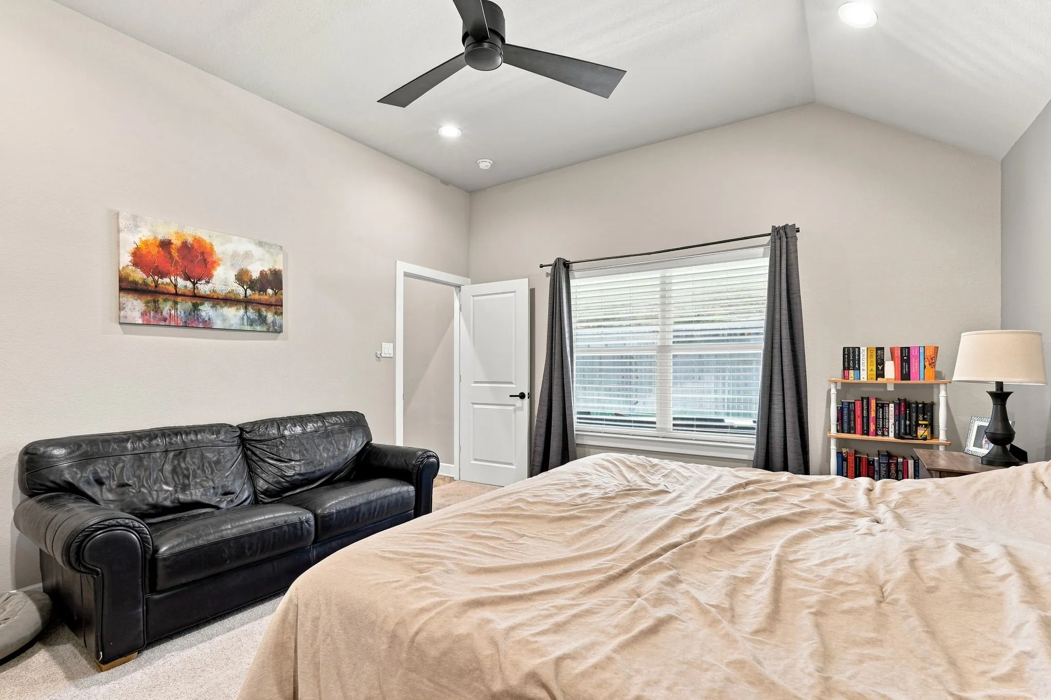 Vaulted ceiling with a ceiling fan, recessed lighting, and window with blinds