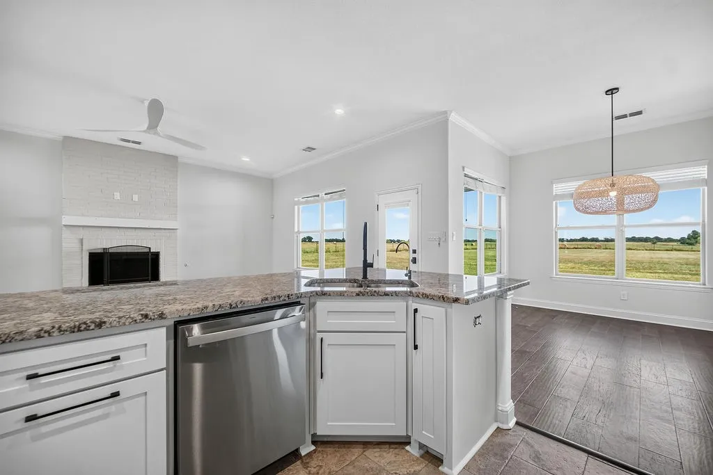 Kitchen island with granite countertops and stainless steel appliances