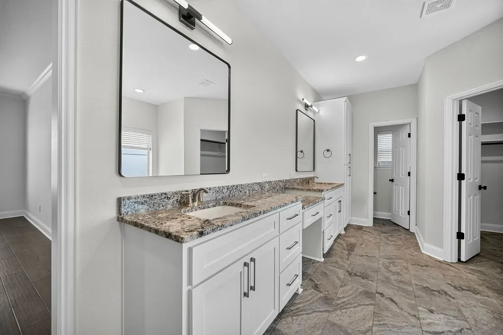 Dual vanity with light-toned countertops and undermount​​‌​​​​‌​​‌‌​‌‌​​​‌‌​‌​‌​‌​​​‌​​ sinks