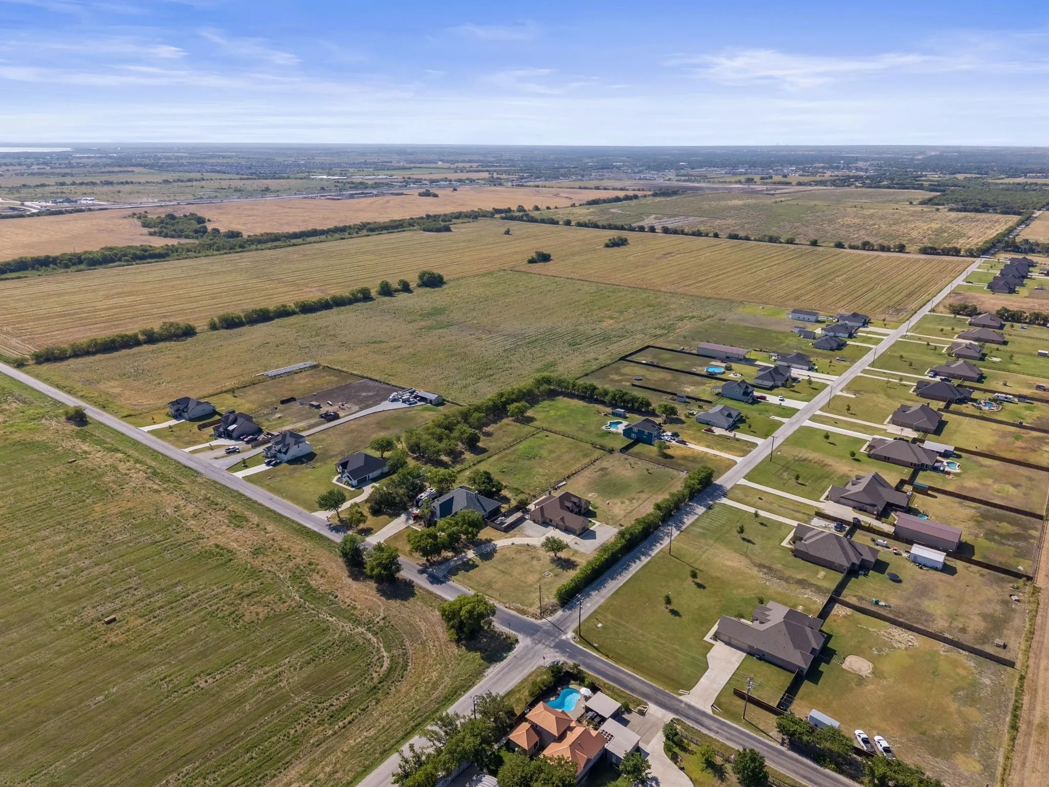 Rural residential area with extensive open land and developed roads