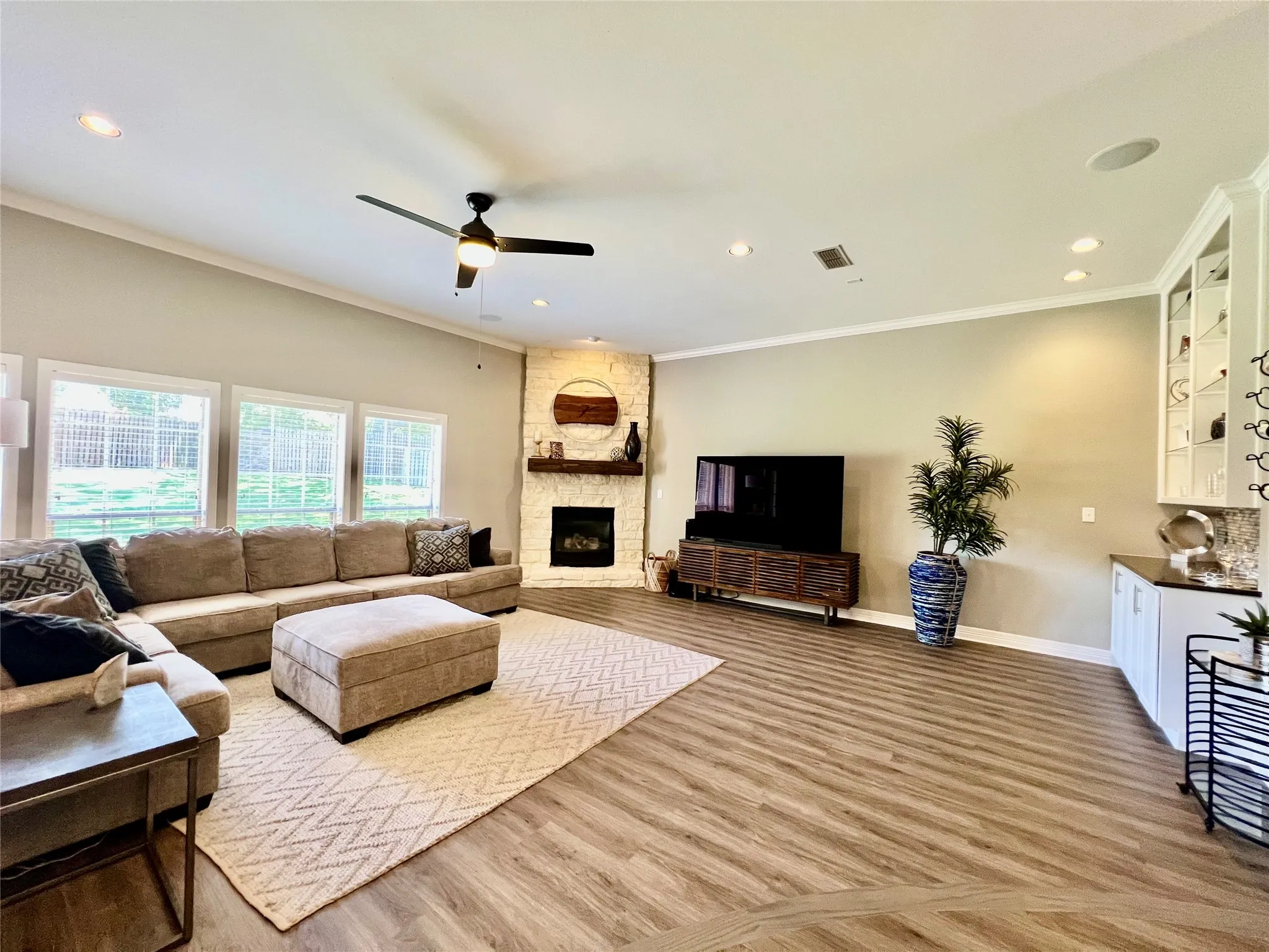 Austin Stone Fplc anchors the open lvng area.