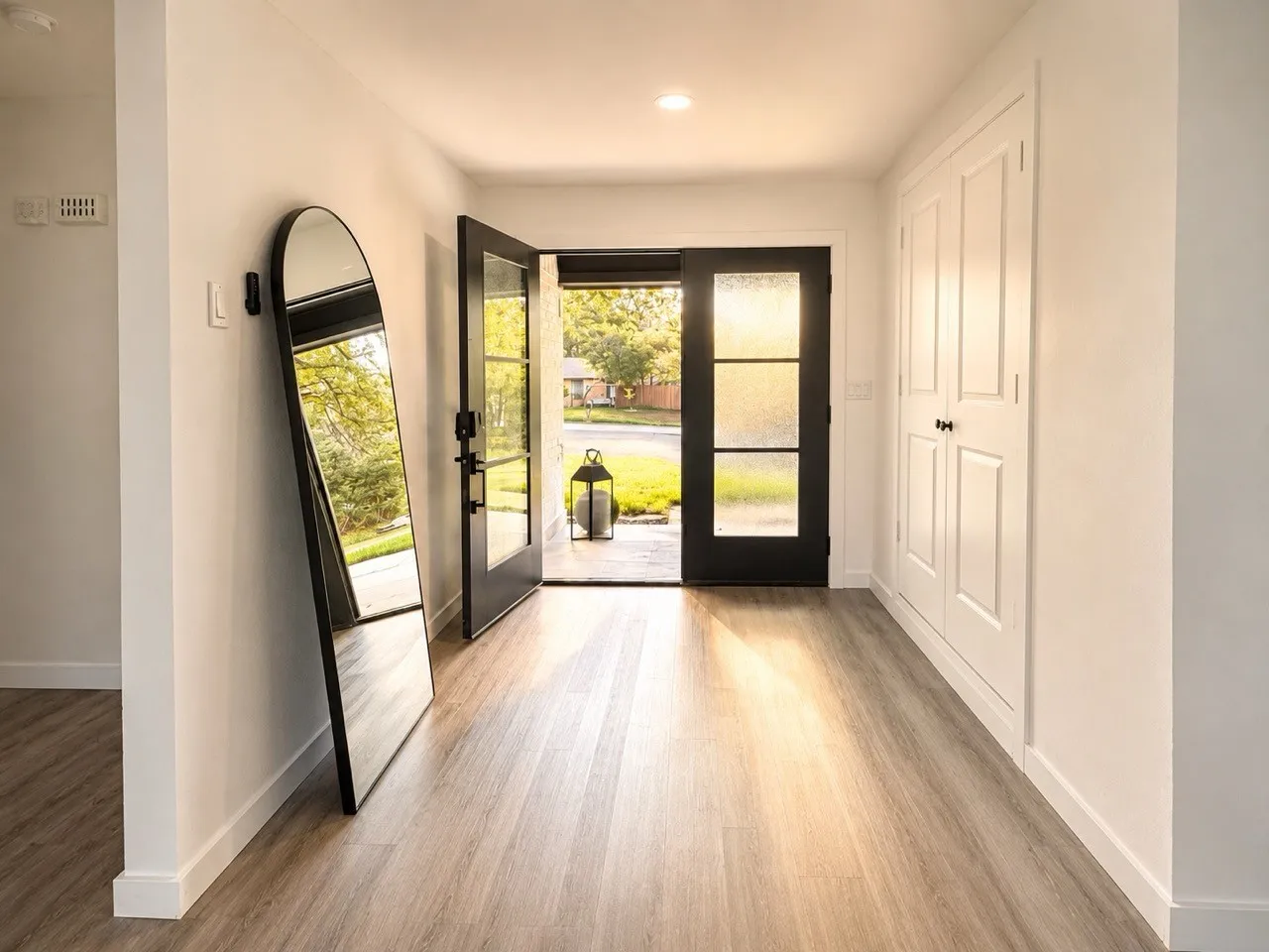Entryway featuring wood-finish flooring, recessed lighting, and a double entry door with obscured glass panels