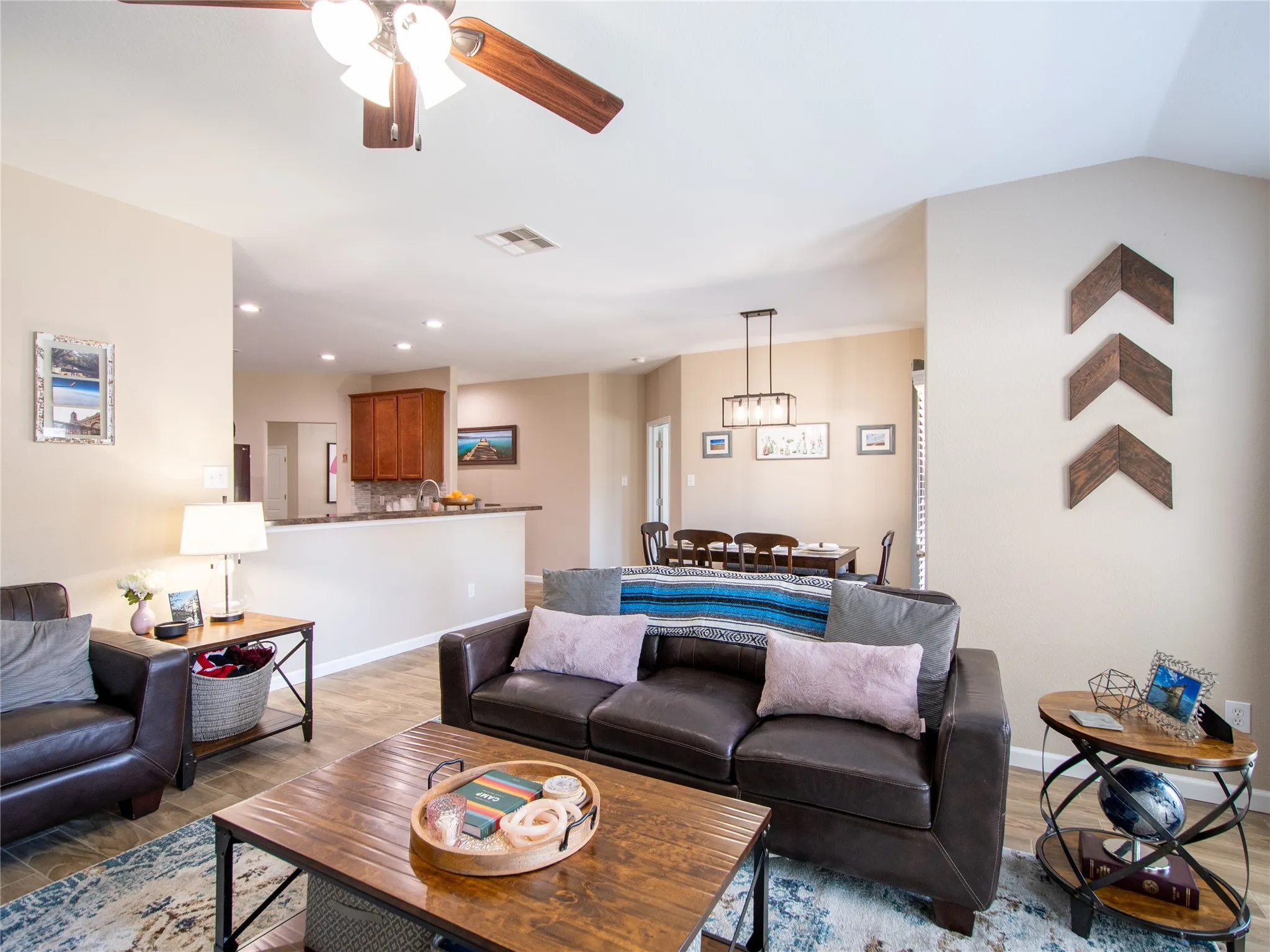 Vaulted ceiling with a ceiling fan