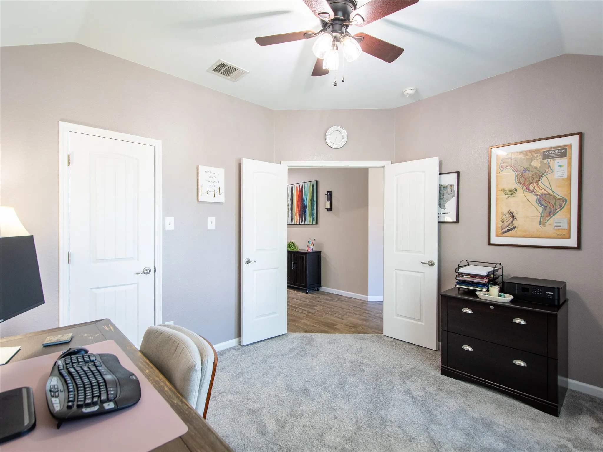 Office or Bedroom 2 Vaulted ceiling with a ceiling fan, light gray wall paint, light gray carpeting, and white interior doors