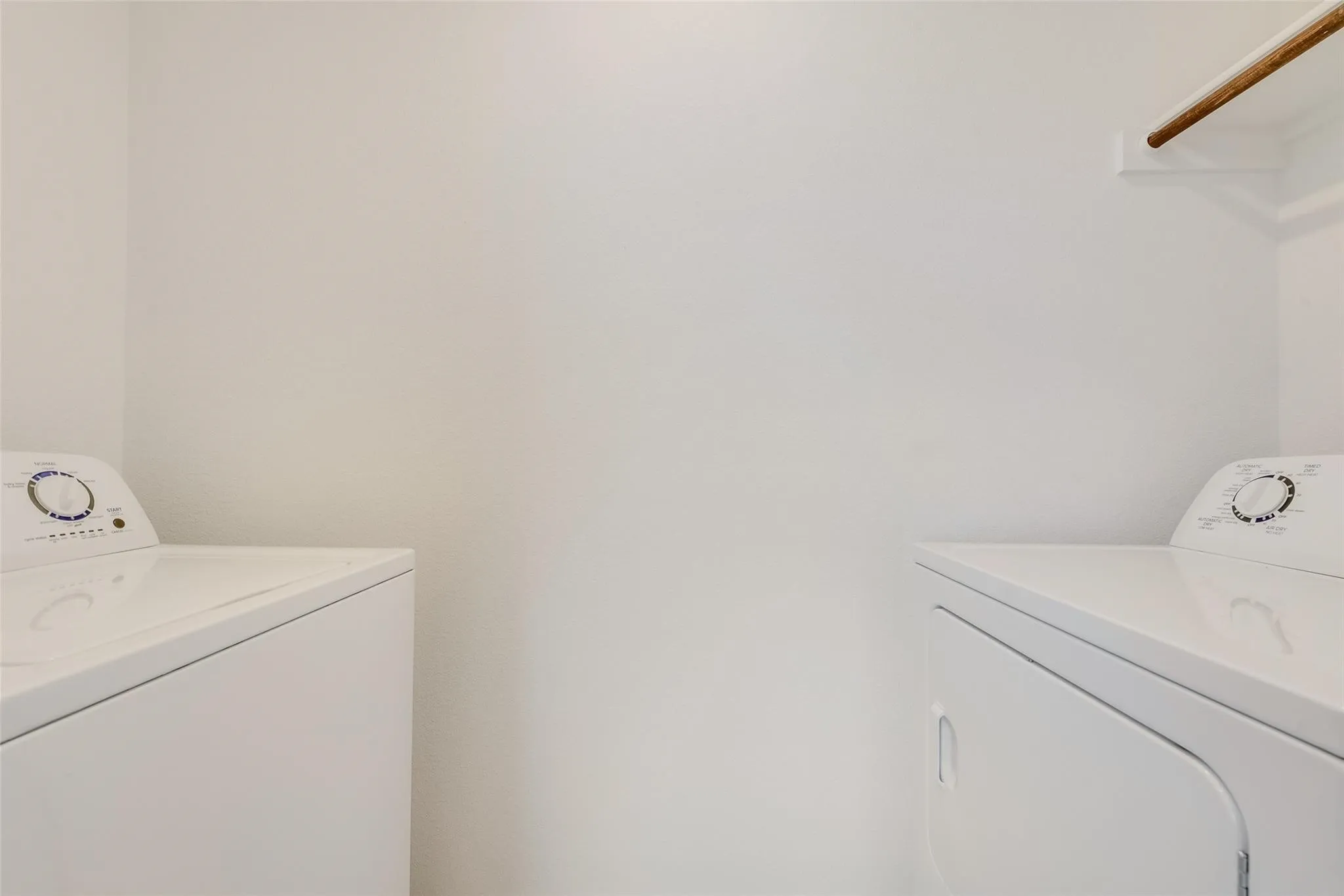 White appliances, wall-mounted drying rod, white walls