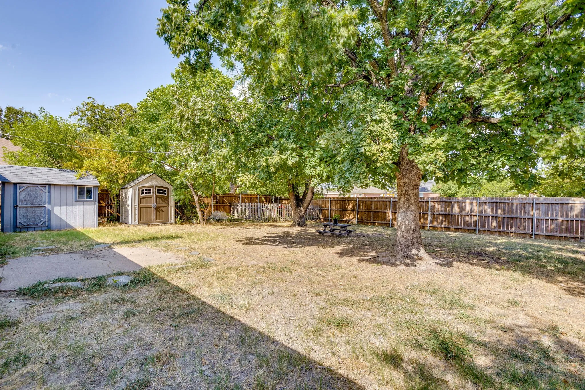 Showing the storage shed and the "bonus space" perfect for a mancave, she-shed, office, etc.