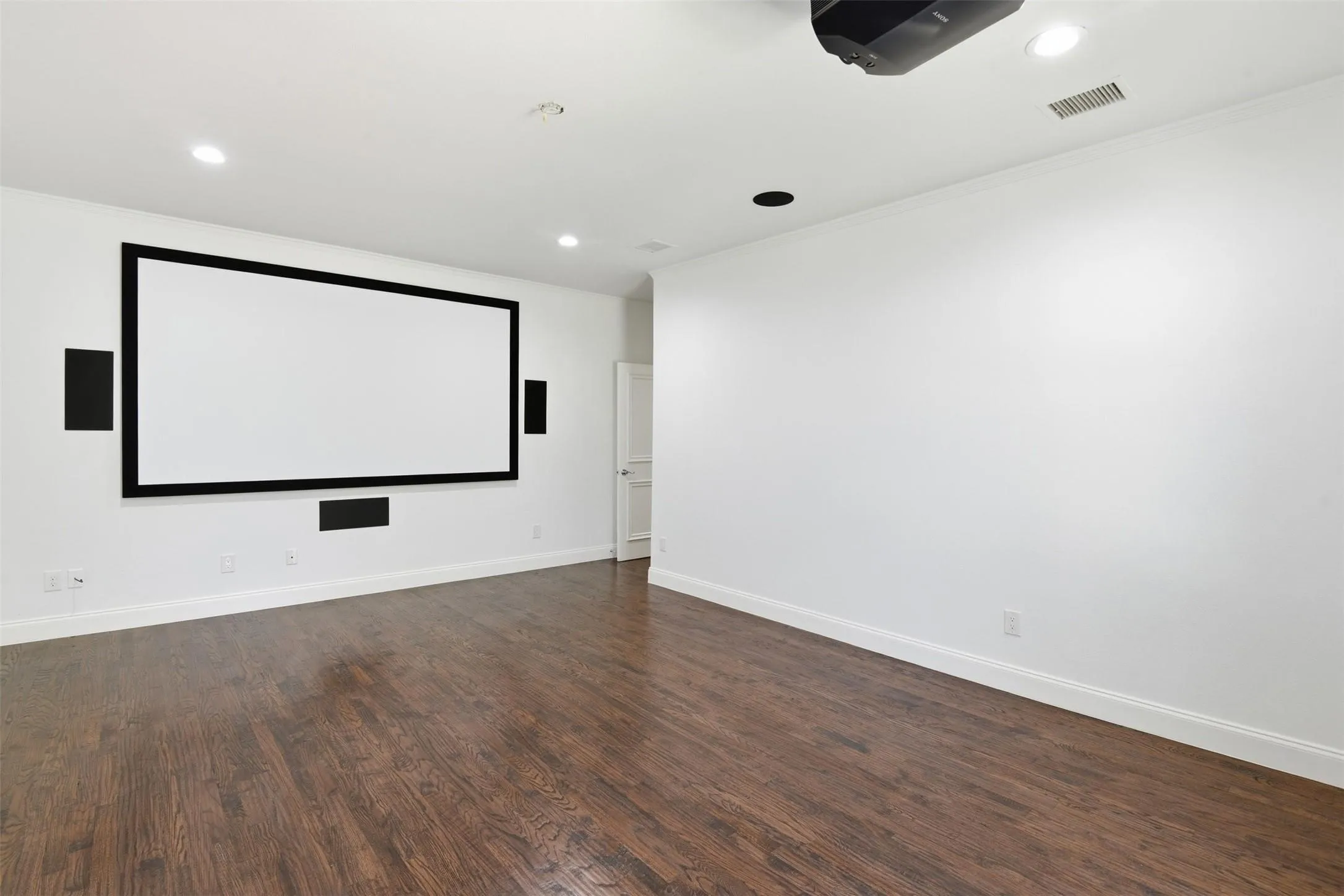 Large projection screen with integrated speakers