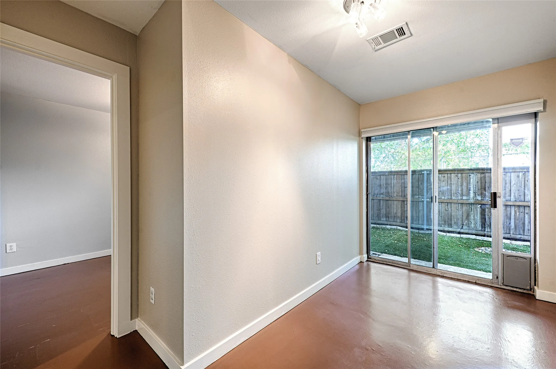 Den with access to backyard