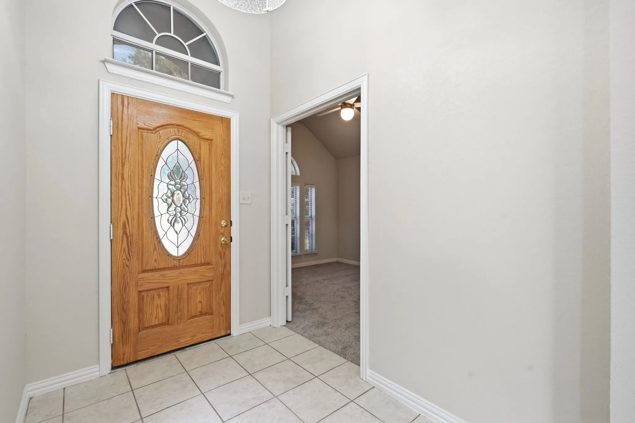 Spacious front entry with updated lighting