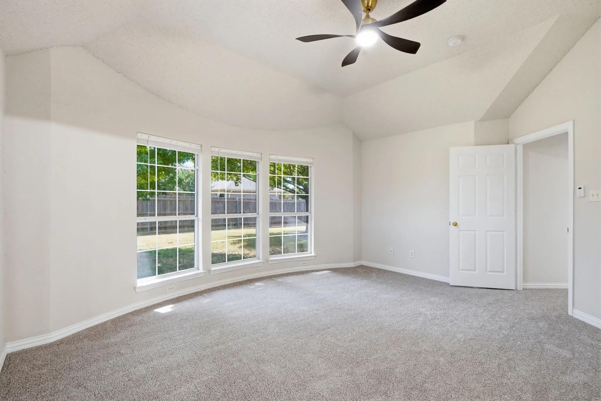 Spacious primary bedroom with sitting area & ensuite bathroom