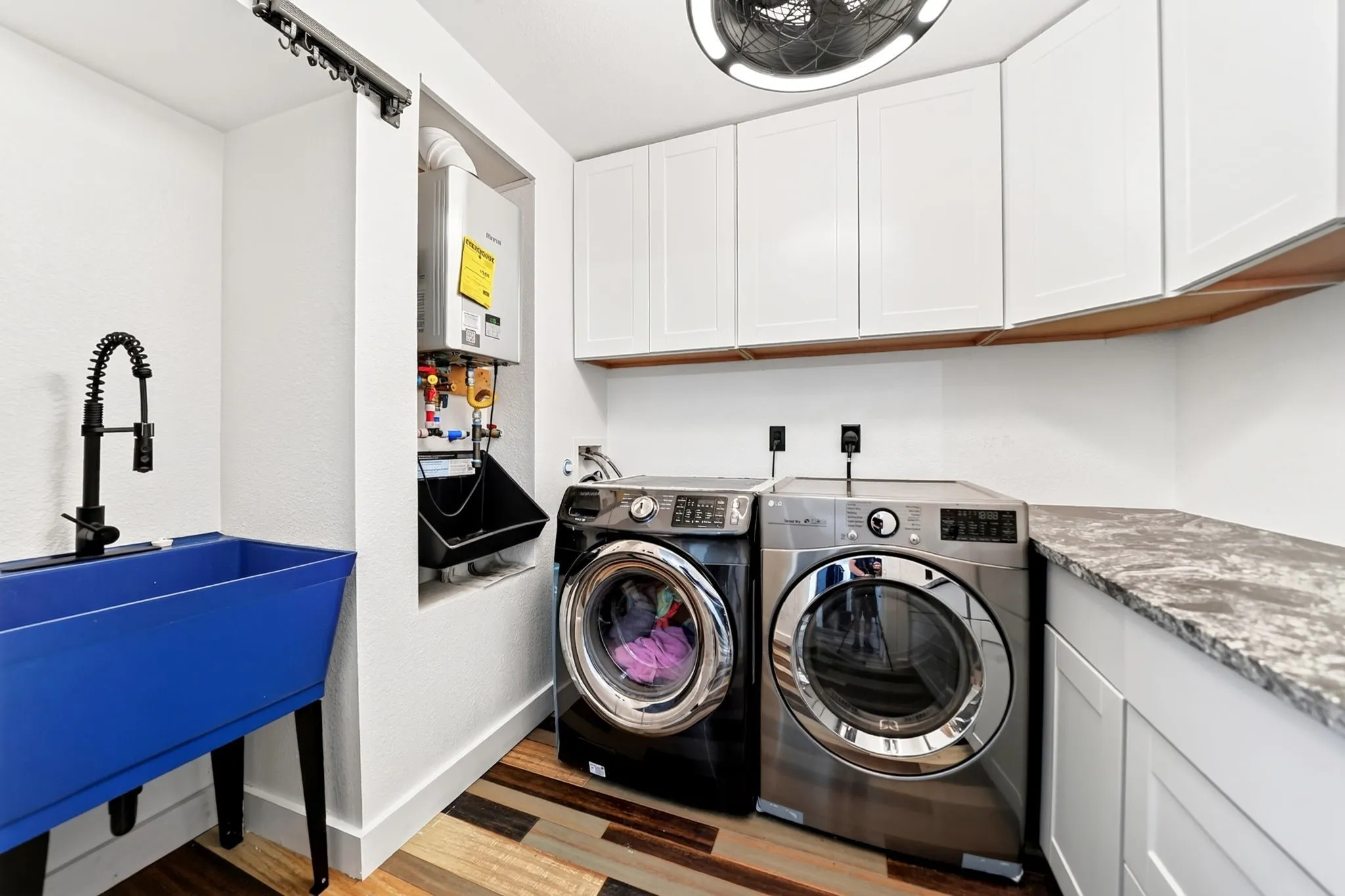 White cabinetry and wood-finish flooring