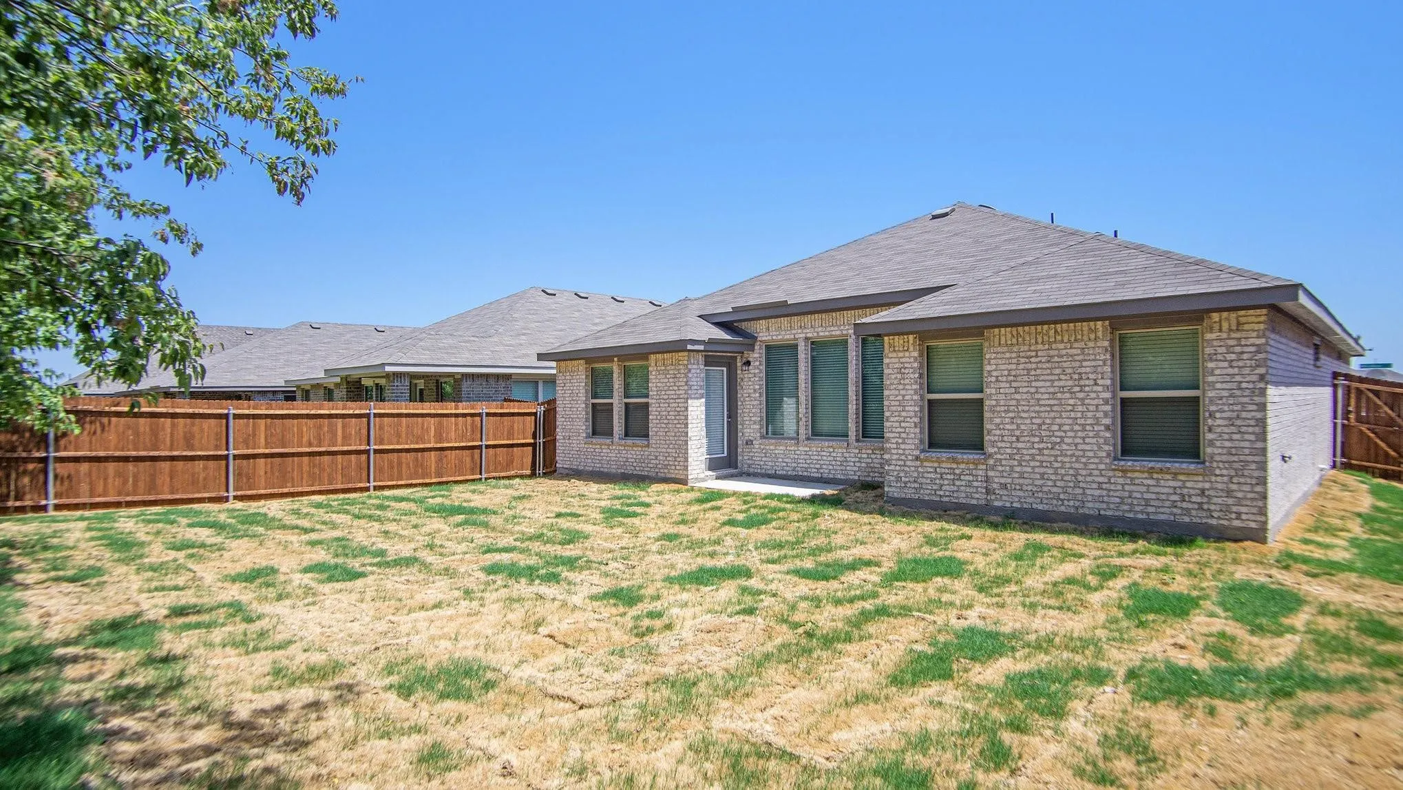 Expansive backyard with a full privacy fence