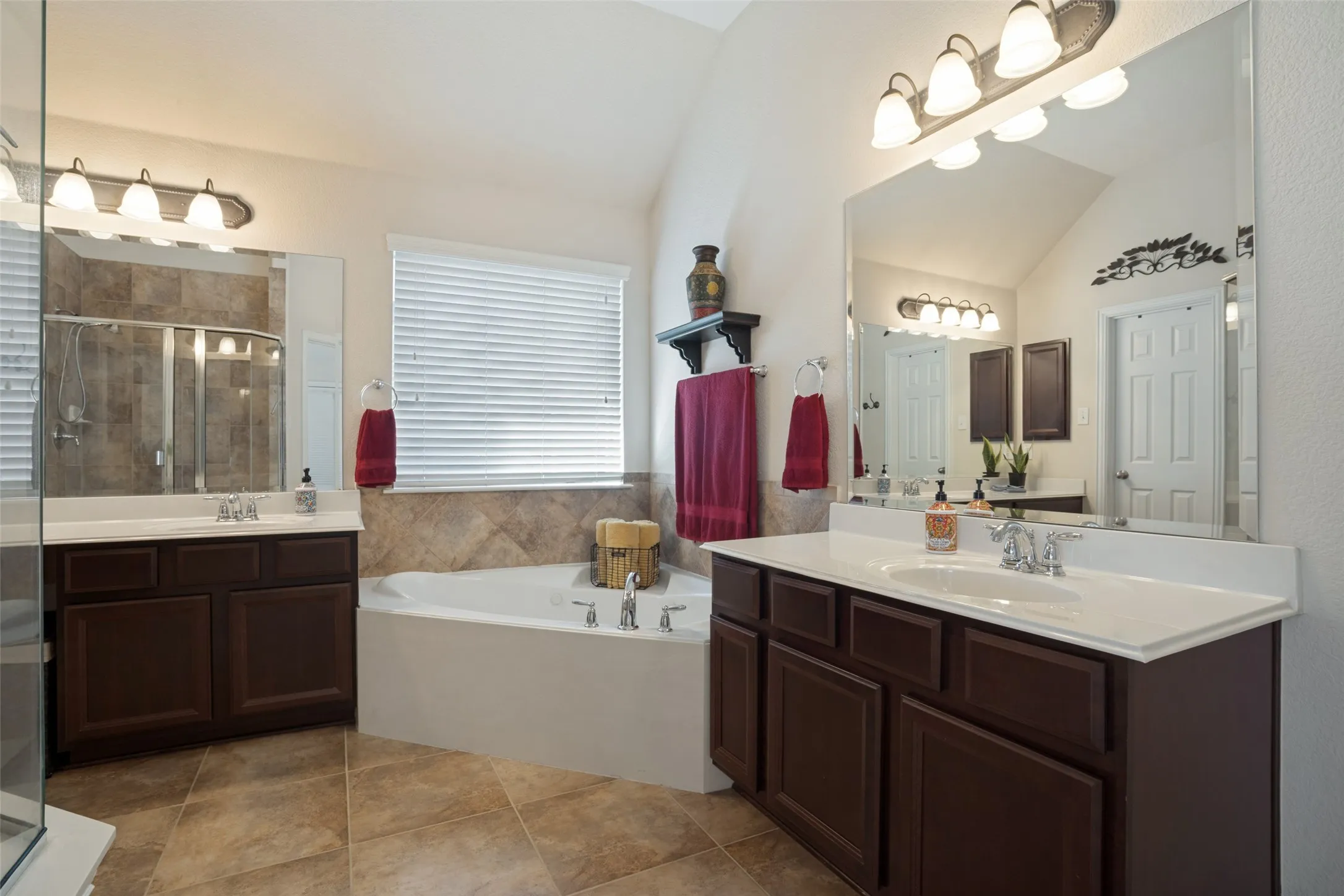 Seperate vanities and a large walk in closet