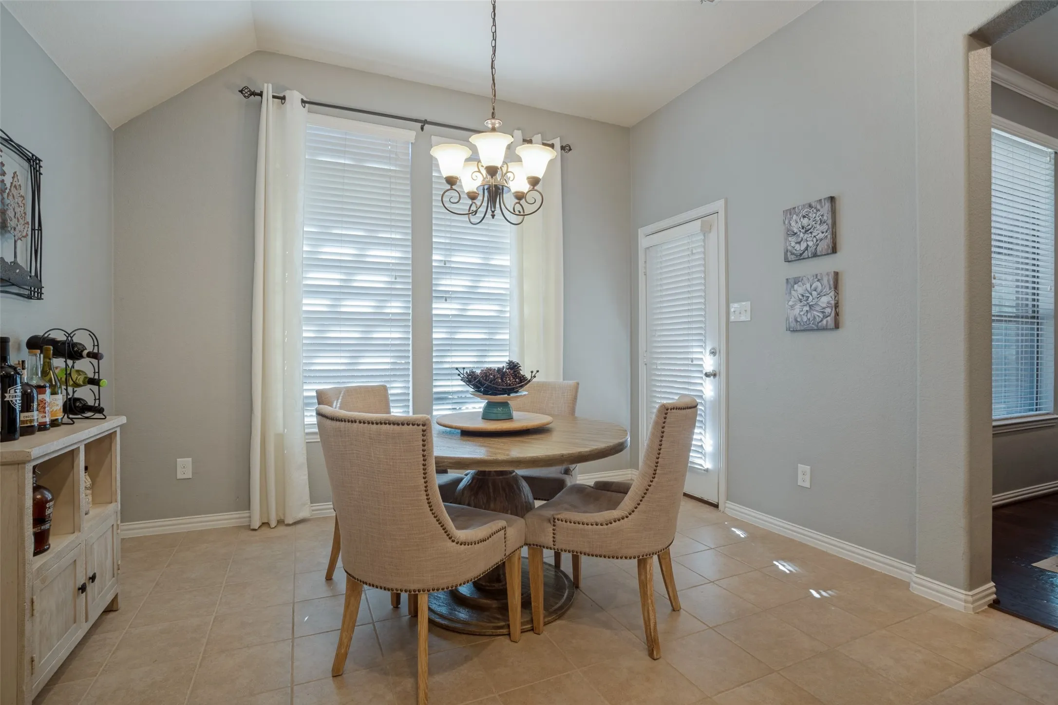 The kitchen nook is spacious and has nice views of the backyard