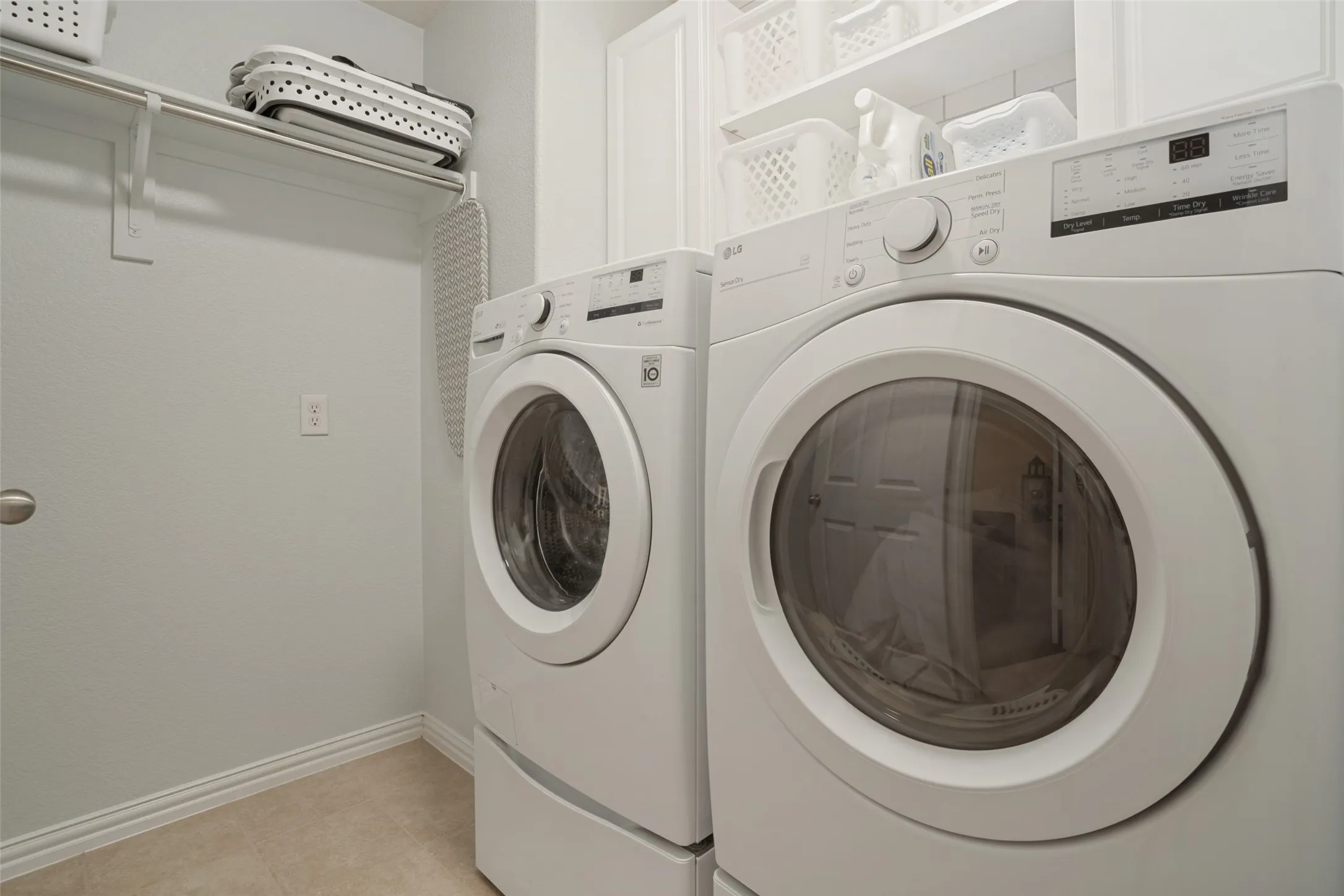 Spacious laundry with room for hang space and storage