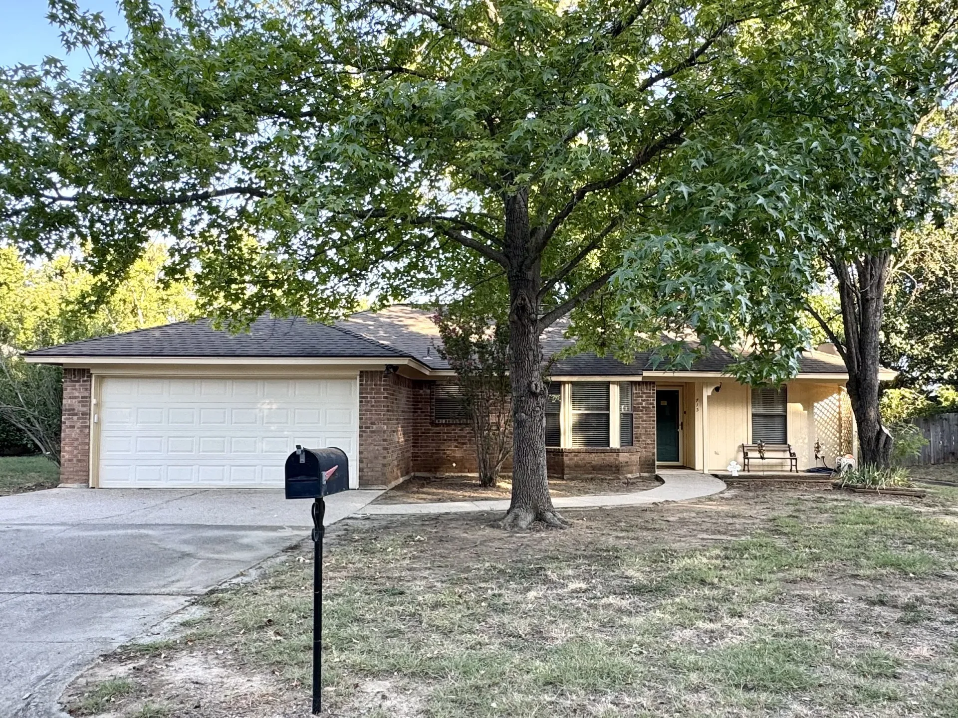 Move-In Ready Brick Home: 3 beds, 2 baths, 2-car garage, 1 living room, 1 dining room, covered front & back porches, and the home backs up to a greenspace!