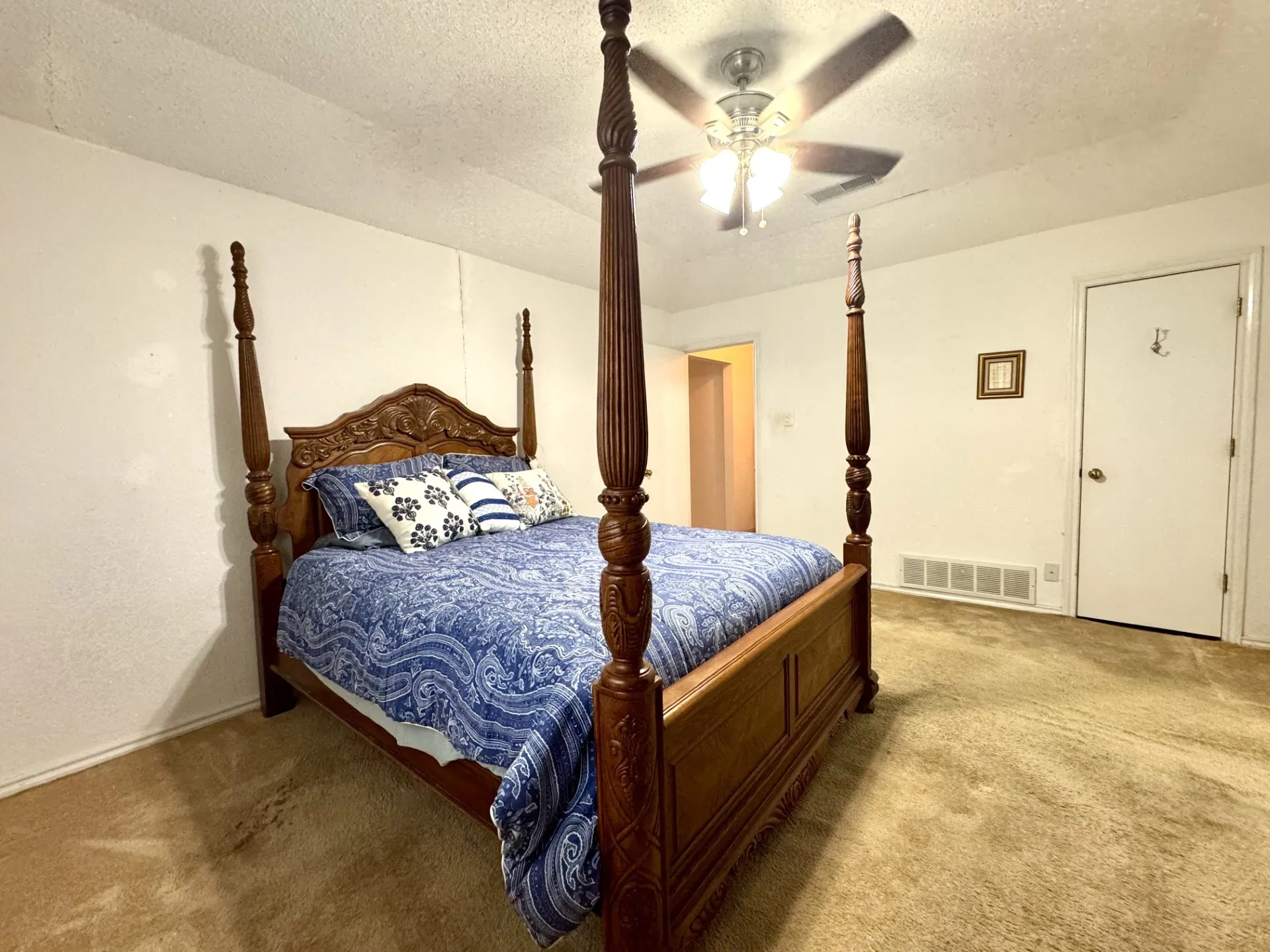 Primary Bedroom: vaulted ceiling with fan AND linen closet with shelving can also be used as a 2nd closet for clothing.