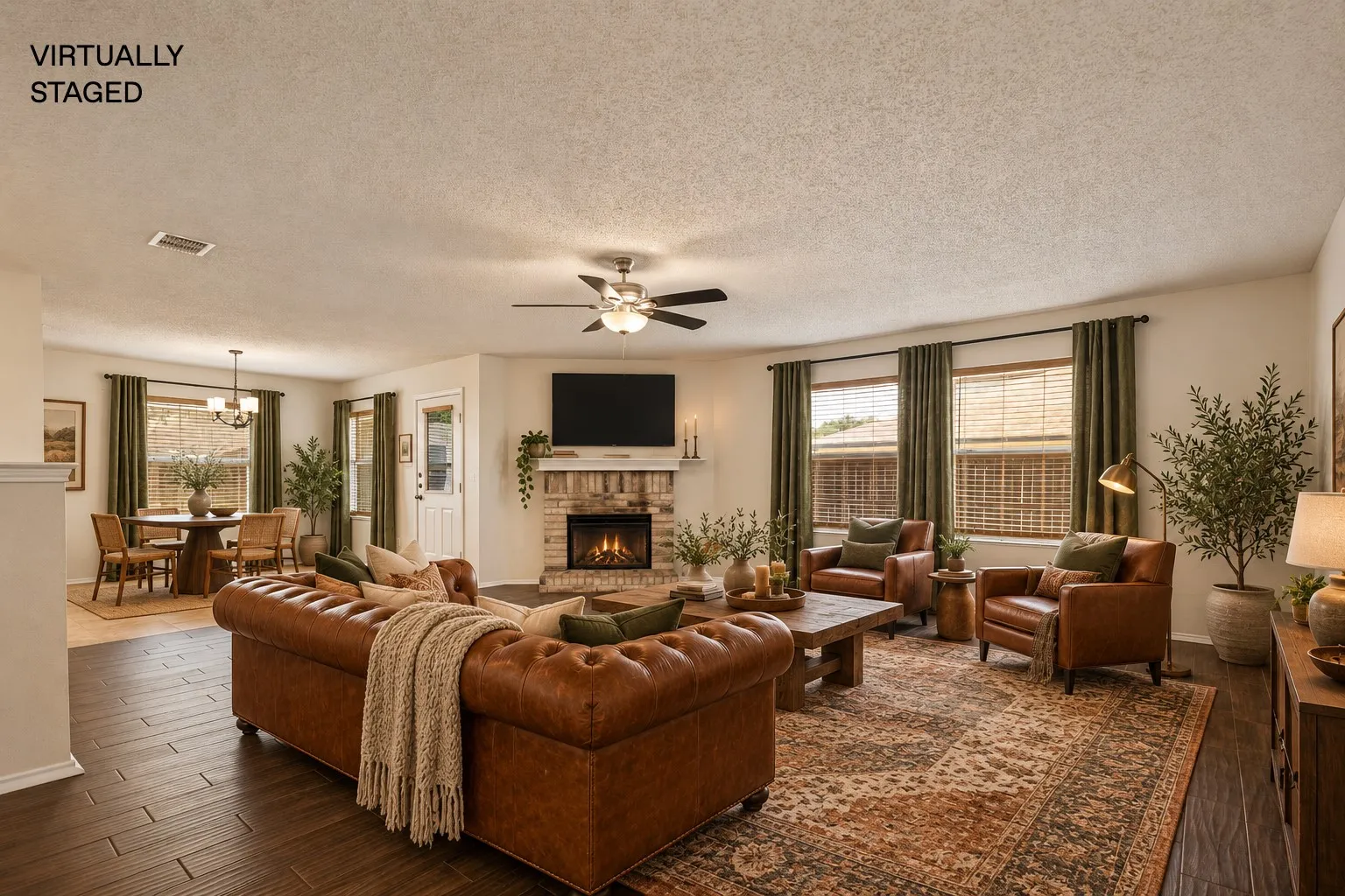 Virtually staged Living area featuring a stone fireplace, dark wood-finish flooring, and a ceiling fan