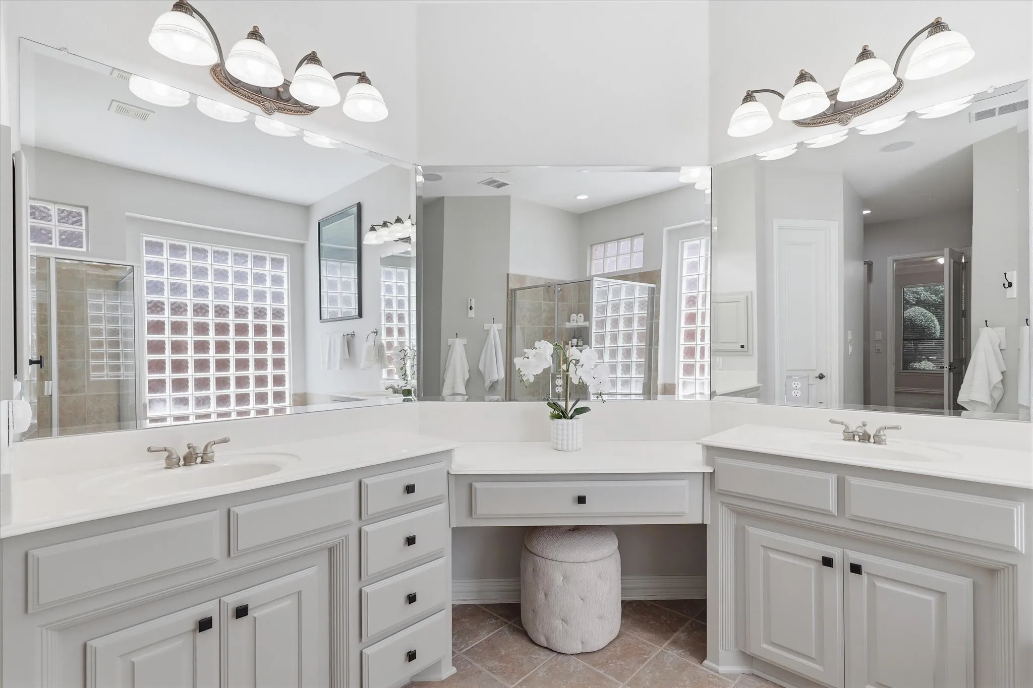 Primary bath split sinks and vanities and a make- up area