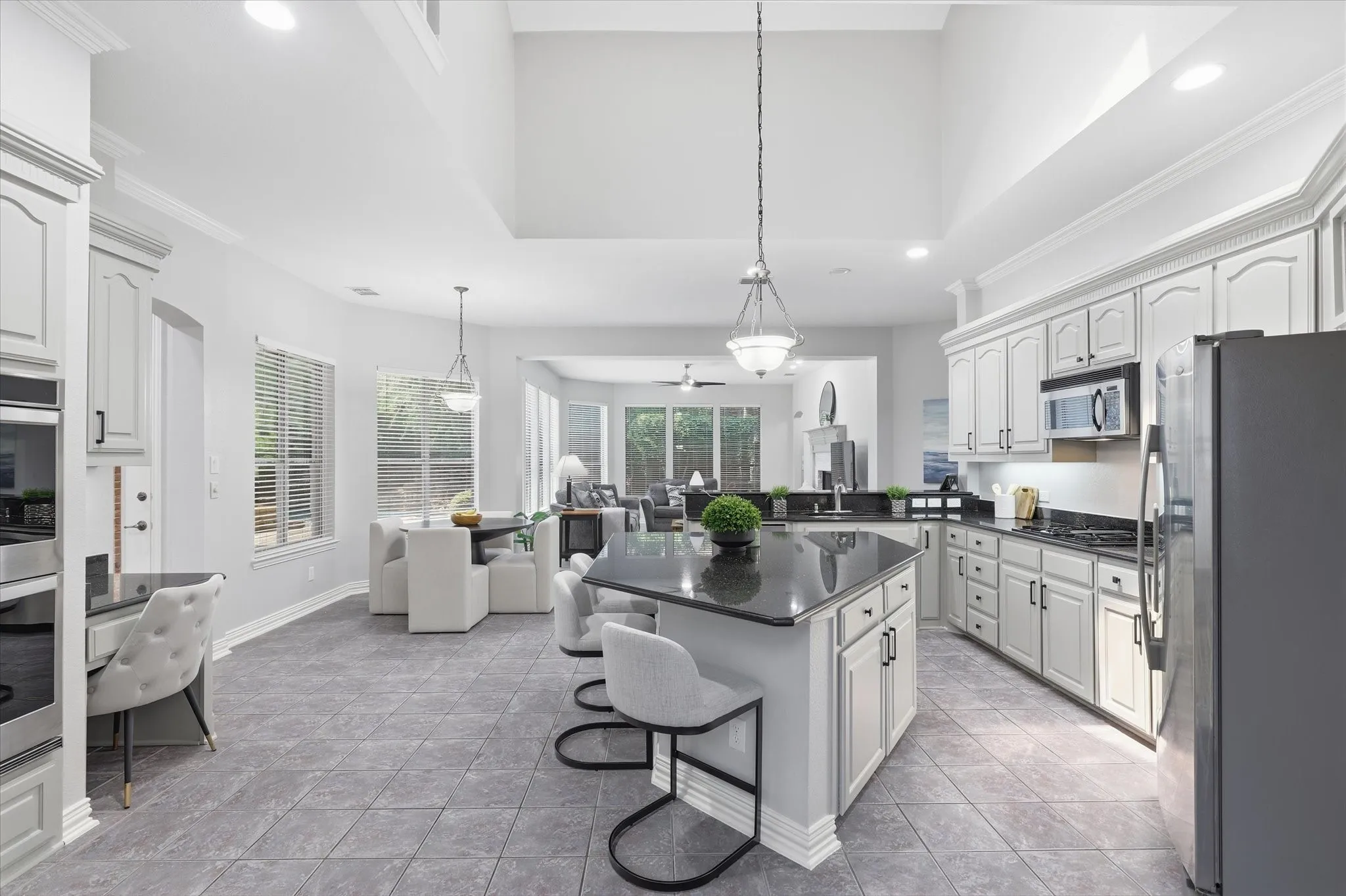 Double ovens, built-in microwave, built-in desk and a Breakfast Bar are features of this Kitchen.