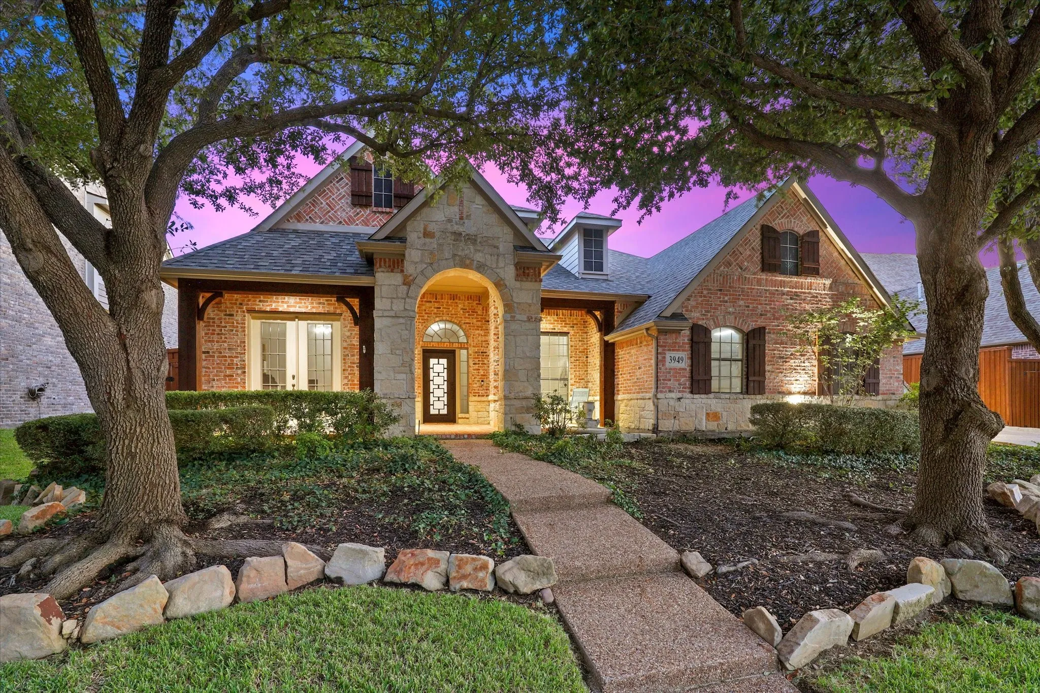 This North facing home offers beautiful trees and a front porch!