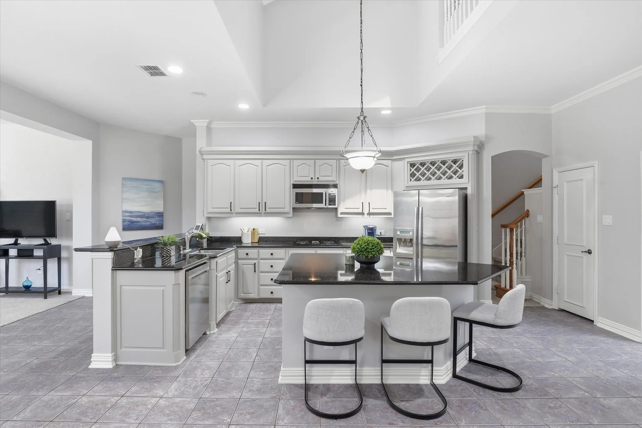 Even the stainless steel refrigerator remains with the home in this Kitchen.