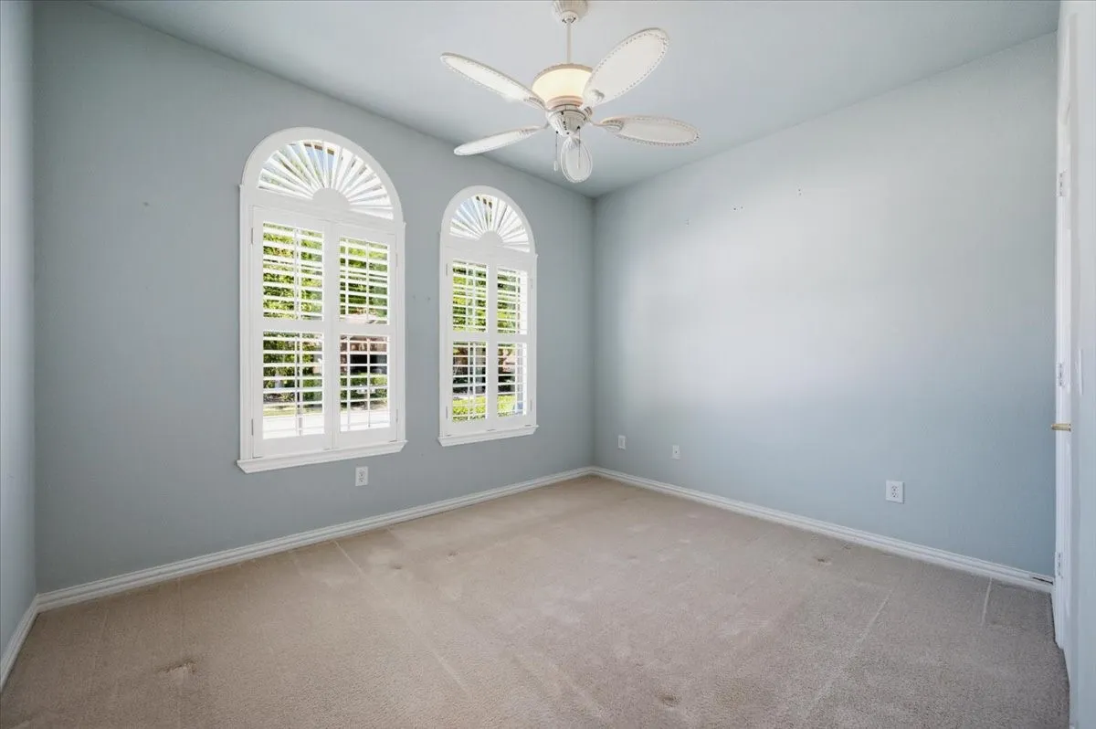 Front bedroom with shutters - full bath adjacent - as guest bath - picture before new paint​​‌​​​​‌​​‌‌​‌‌​​​‌‌​‌​‌​‌​​​‌​​ color