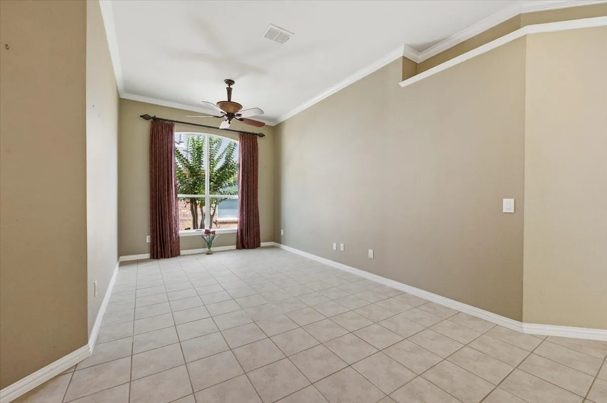 Another view of office or 2nd living area - picture before walls painted and drapes removed