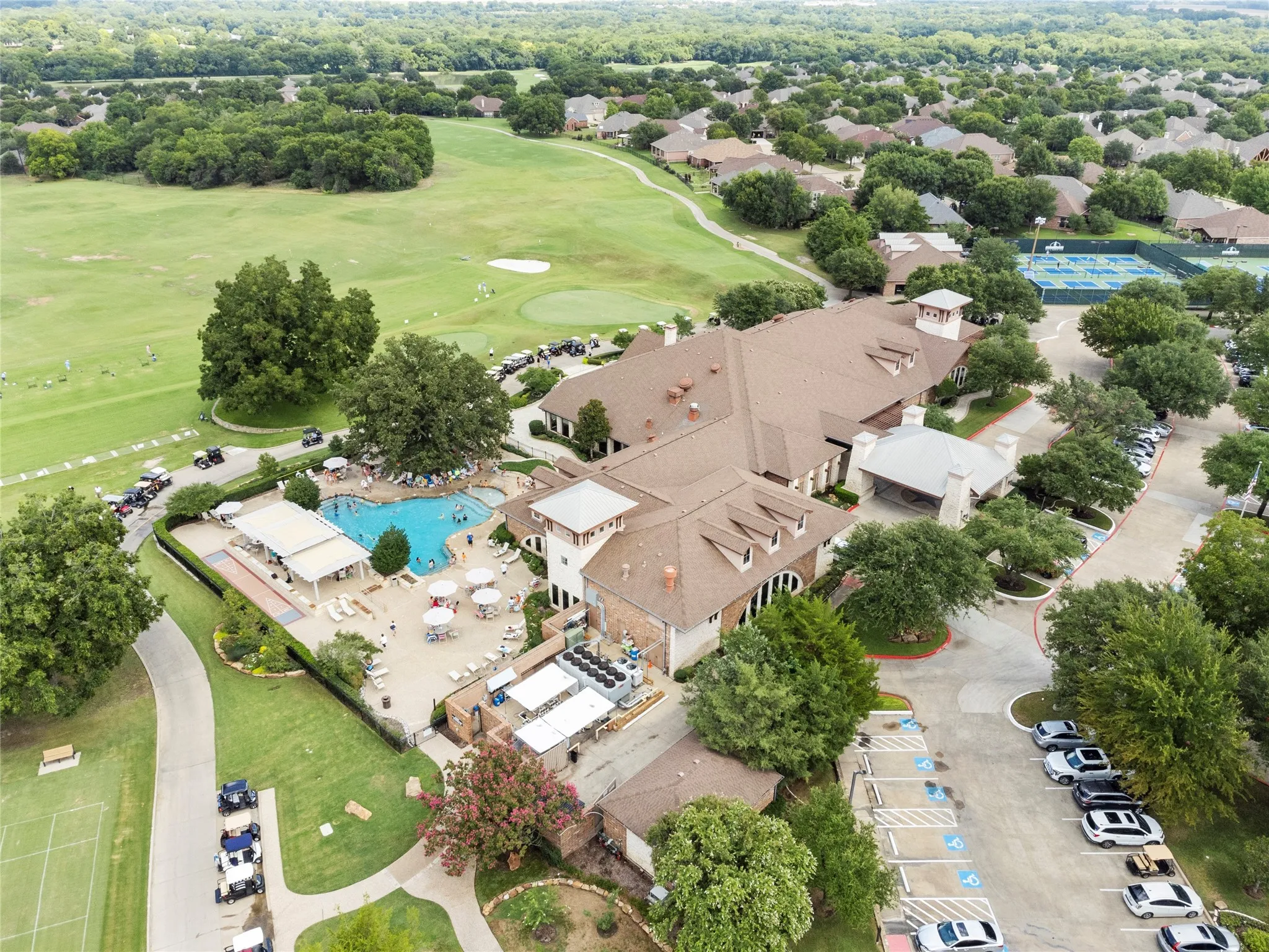 Outdoor pool, clubhouse, pickleball and tennis courts, driving range