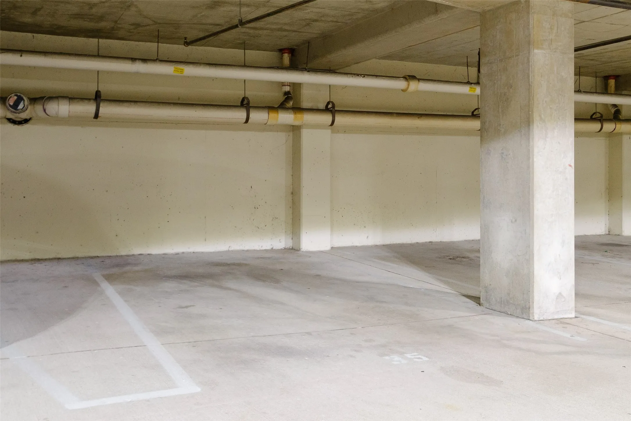 Designated parking space with concrete flooring