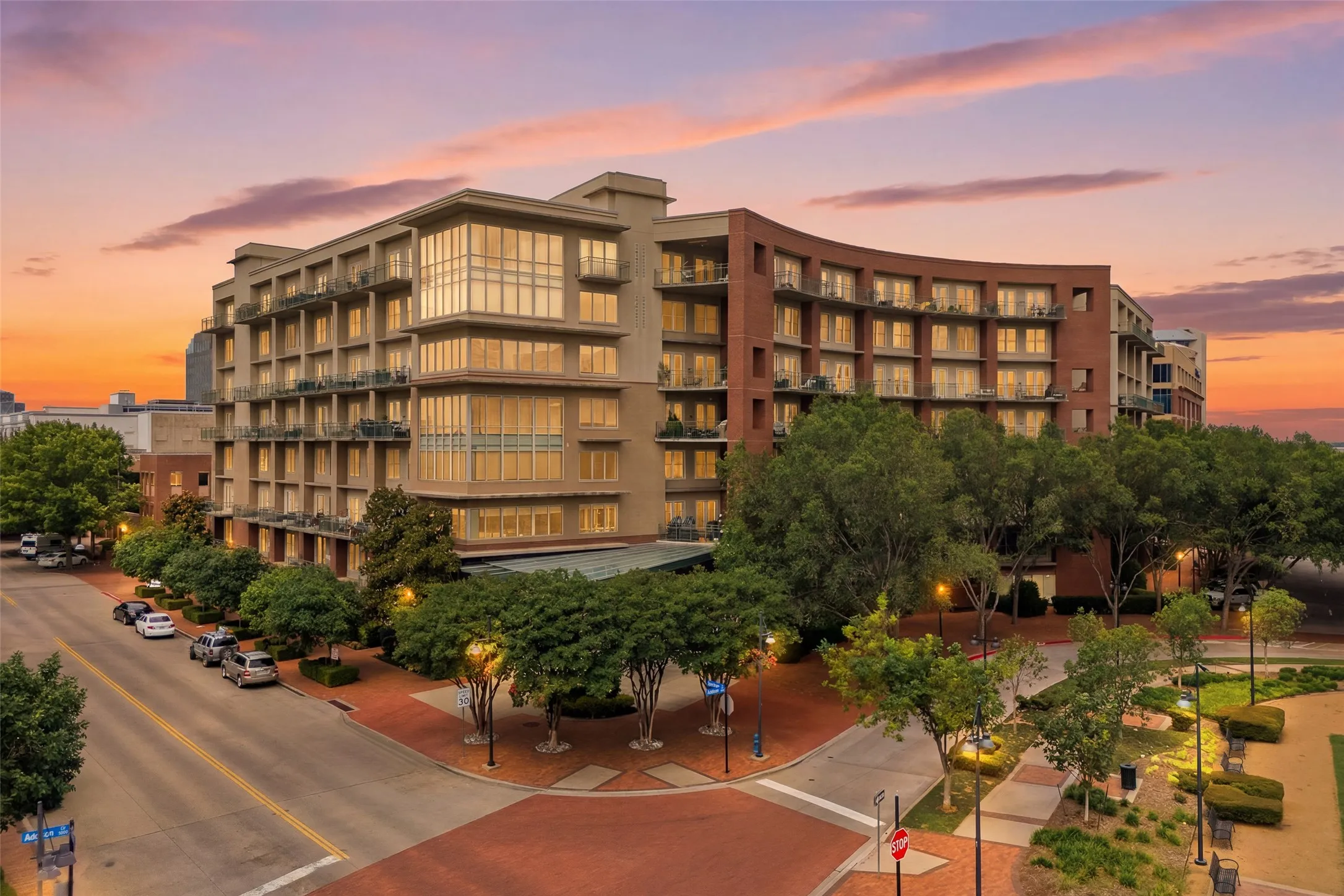 Multi-story building featuring a blend of brick and stucco facades