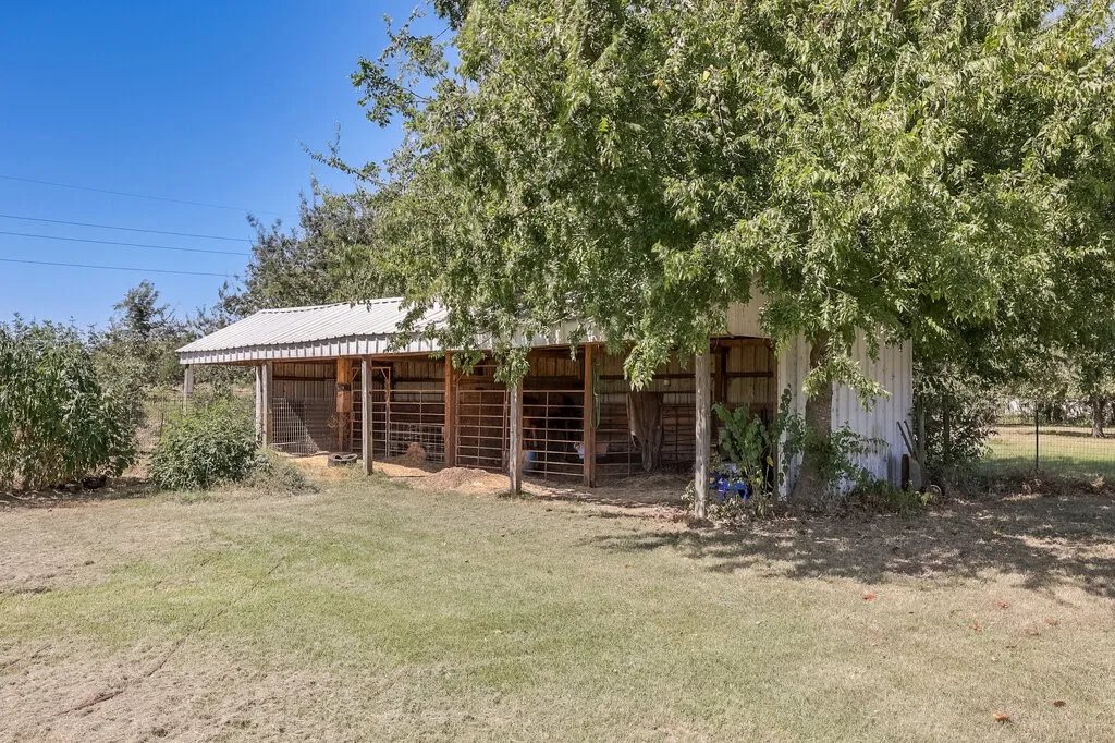 Southwest corner of the two acres & shaded by trees.
