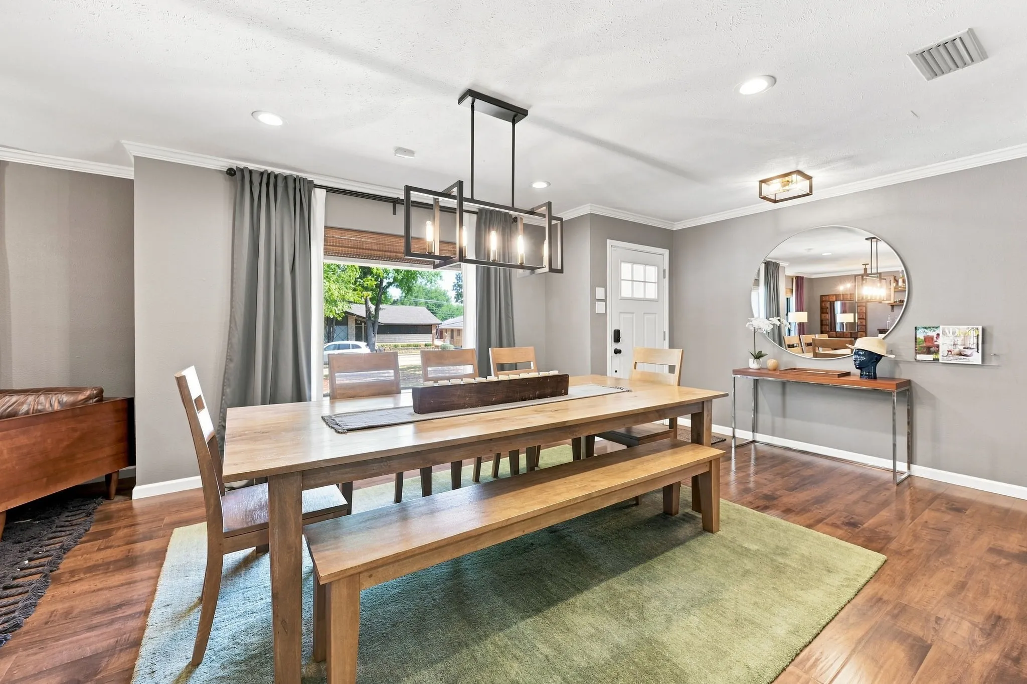 Natural light floods in the picture window in this dining space.