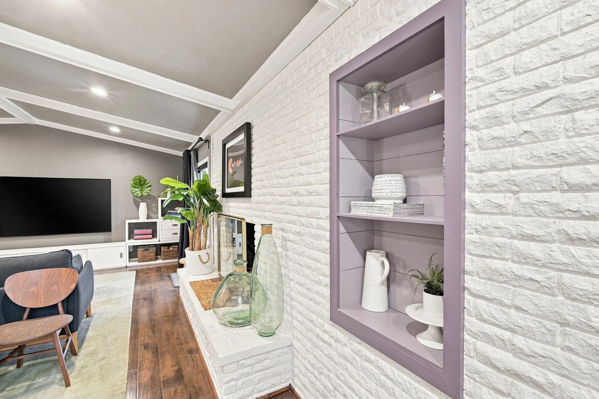 Cool Built-ins for displaying your special pieces and a brick fireplace with a hearth.