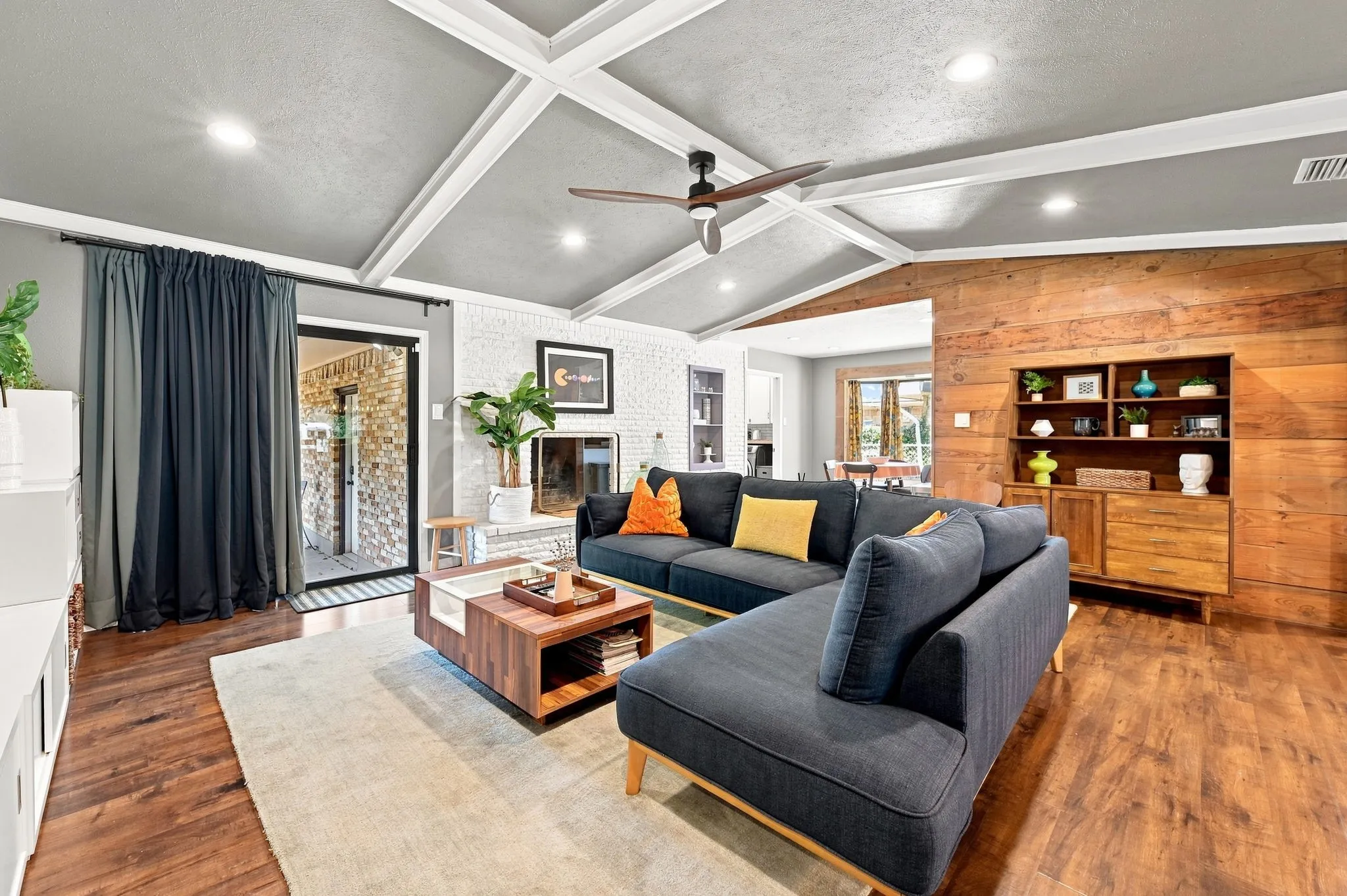 Love the Shiplap wall feature, brick fireplace and built ins.