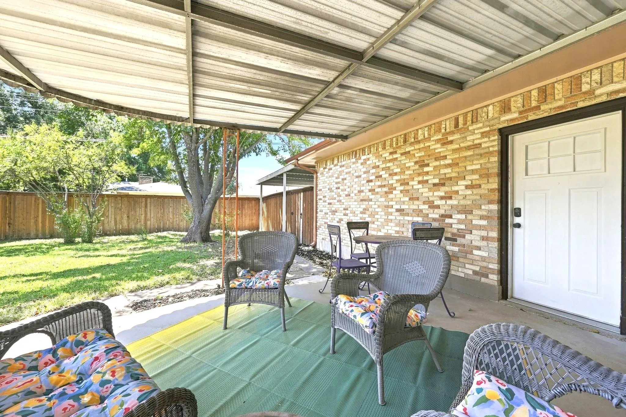 Nice shaded yard. Door leads to the garage.