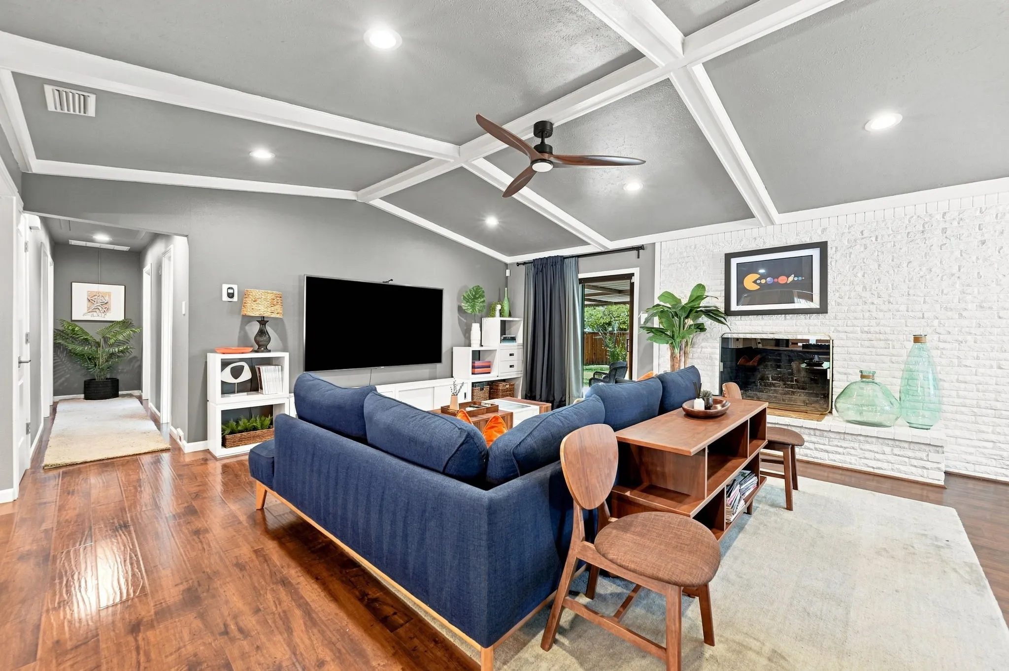 Head to the hallway with the bedrooms & baths. Coat closet in the hallway.