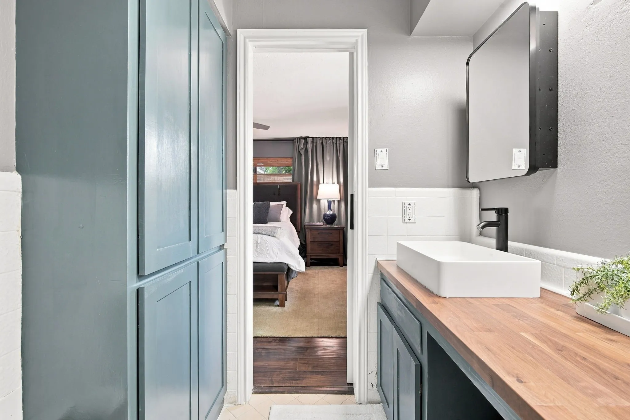 Primary bath has a vanity space ,linen closet and a medicine cabinet.