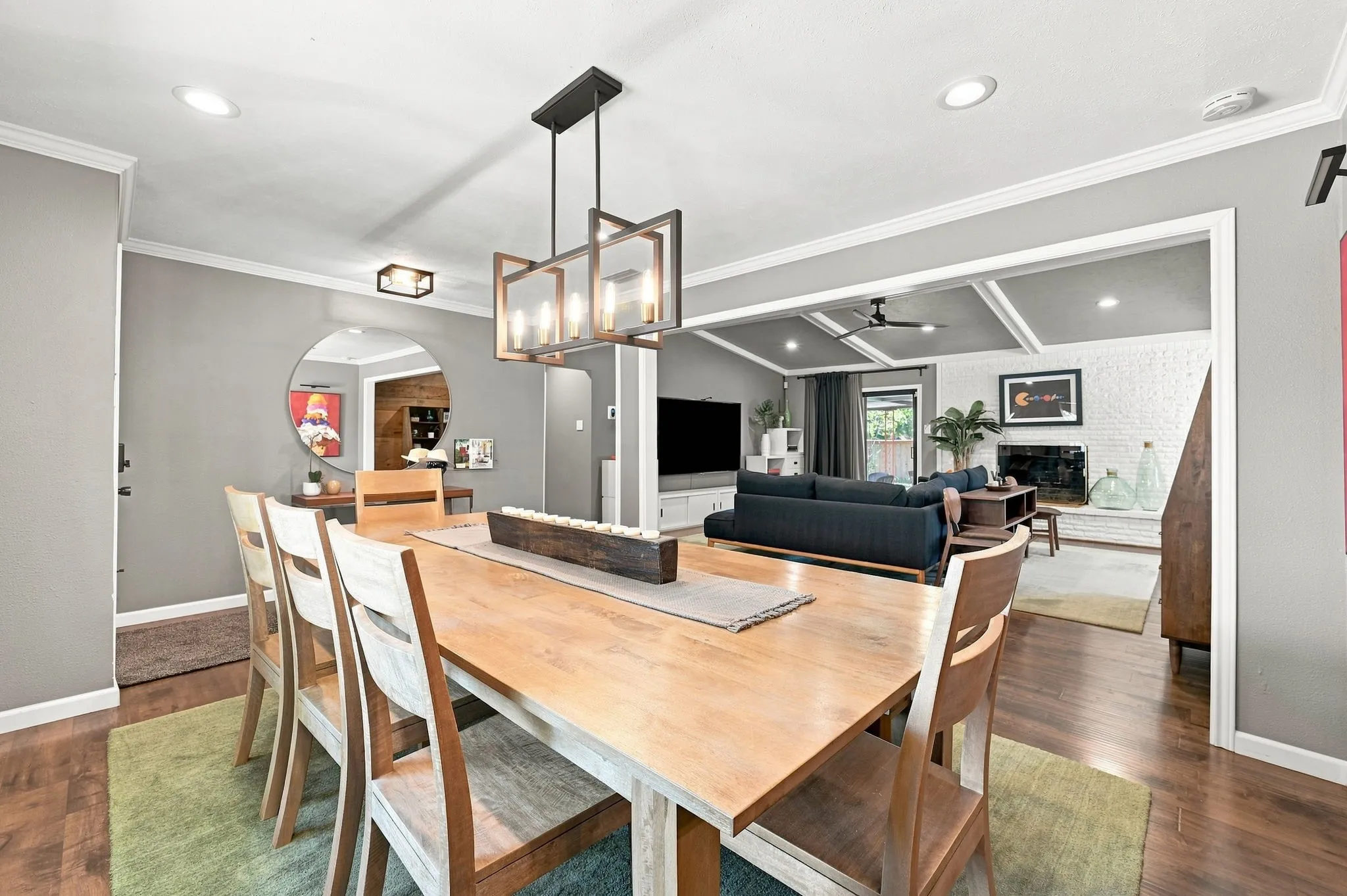 Notice the crown molding a pretty light fixture .