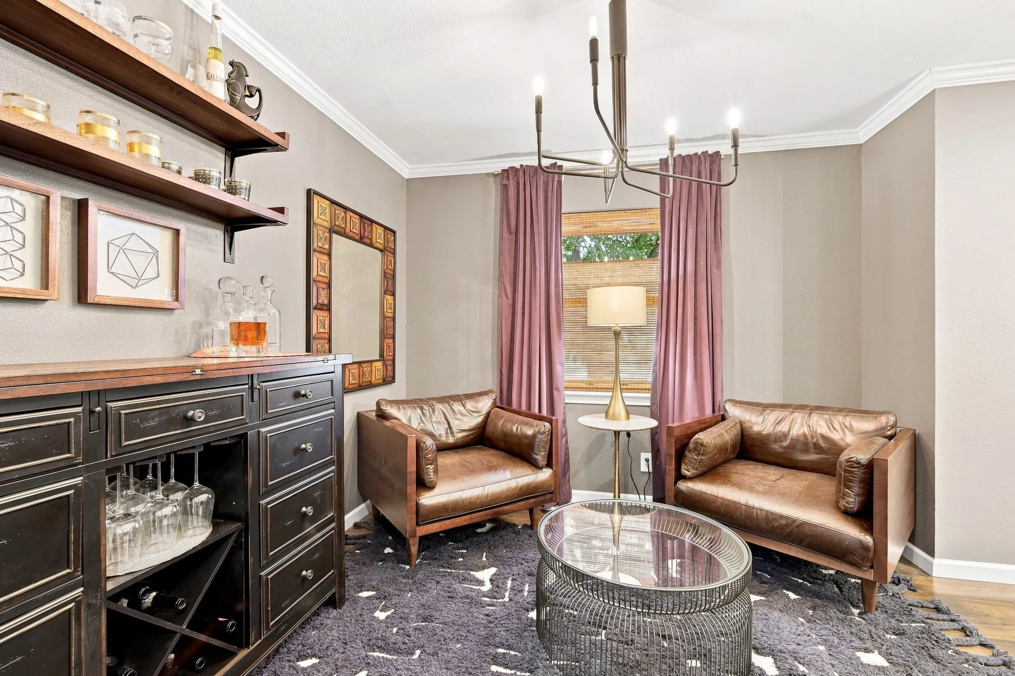 The cool light fixture and wood shelving make this space.