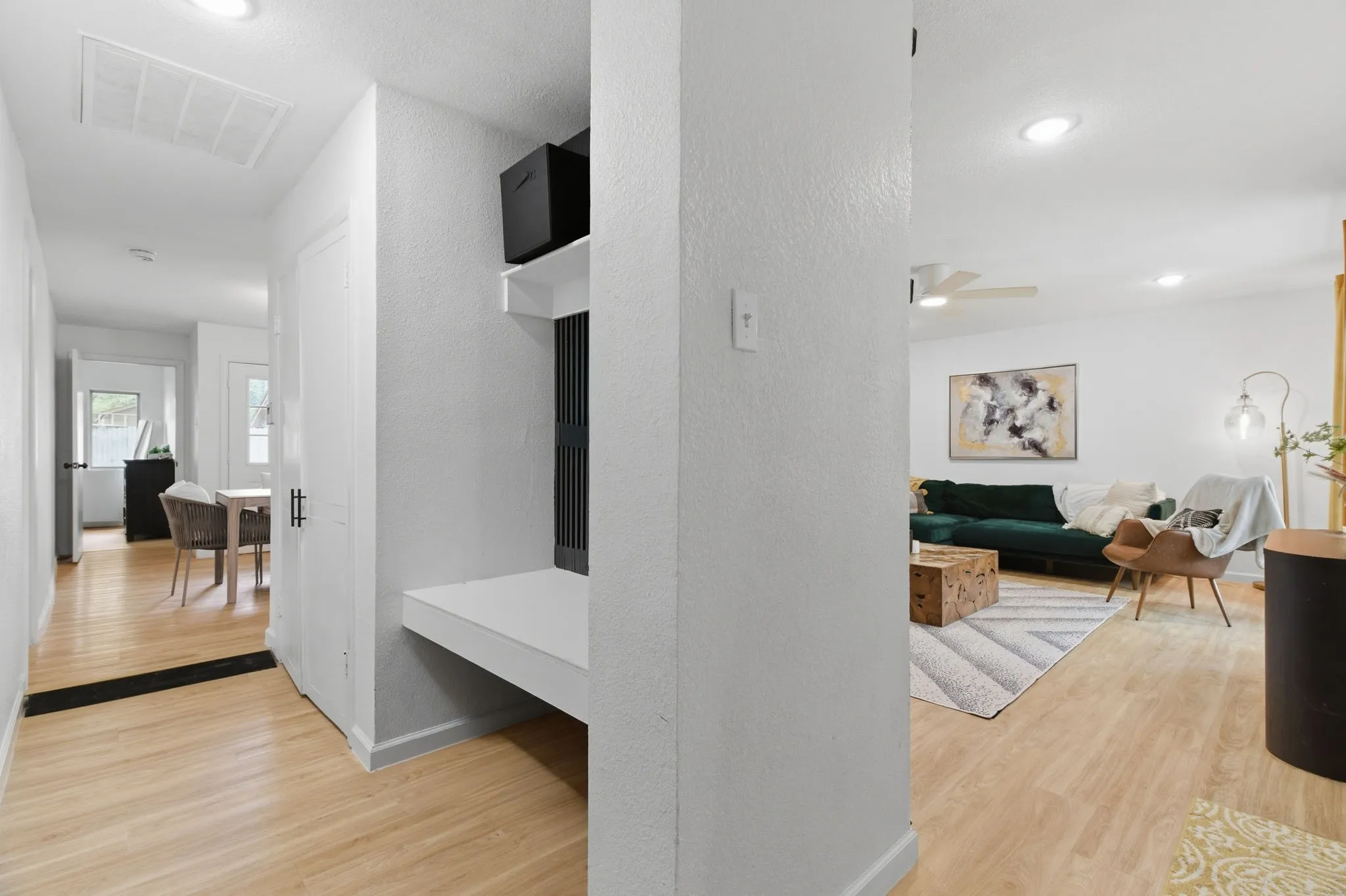 Corridor featuring light wood-type flooring and recessed lighting