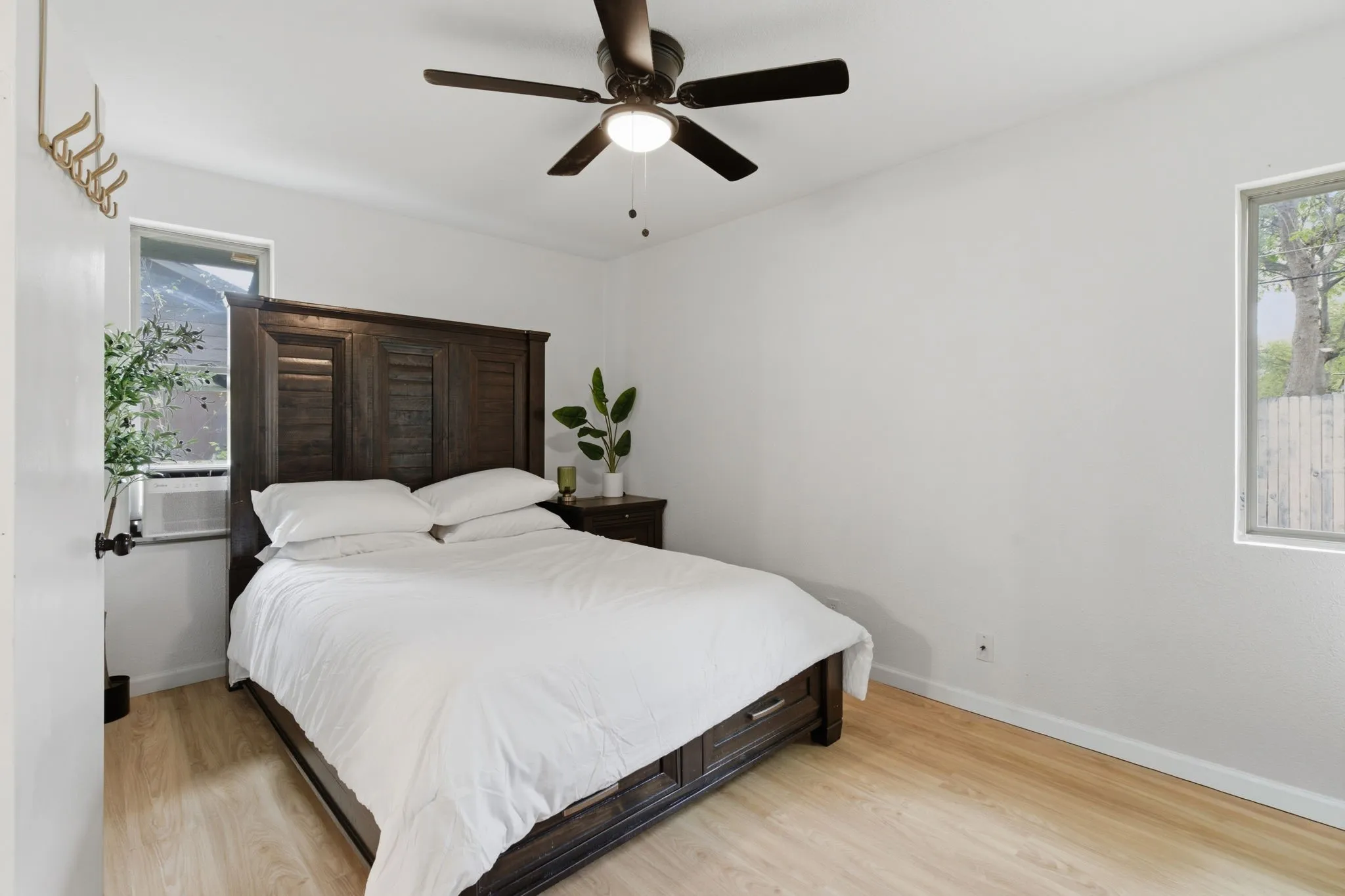 Bedroom featuring light wood finished floors and a ceiling fan