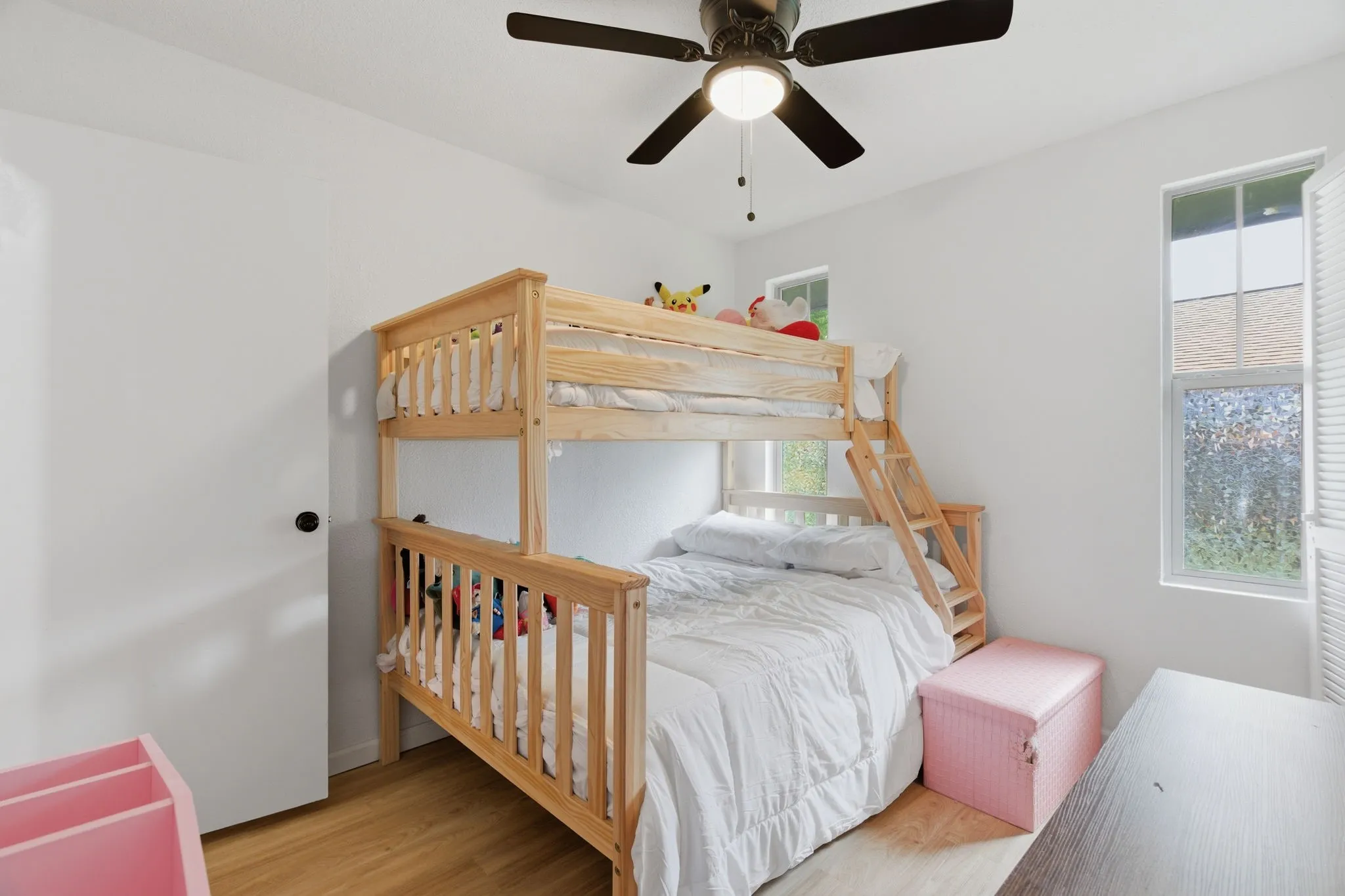 Bedroom featuring light wood-style floors and ceiling fan