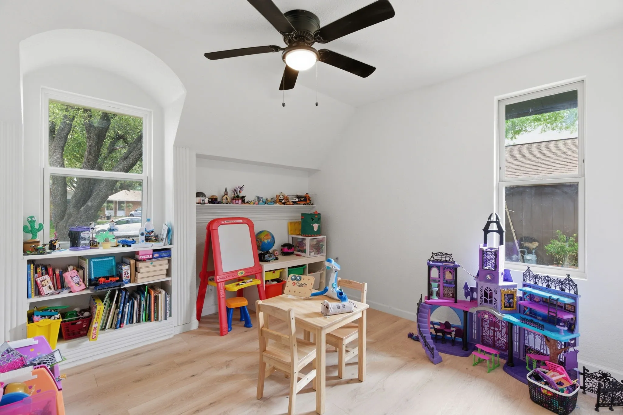 Game room featuring light wood-style flooring, a ceiling fan, and lofted ceiling