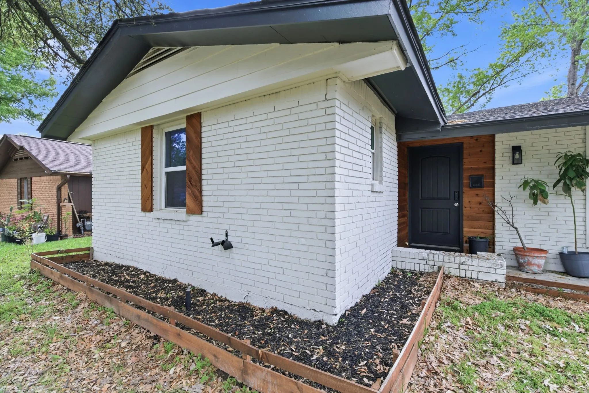Entrance to property with brick siding
