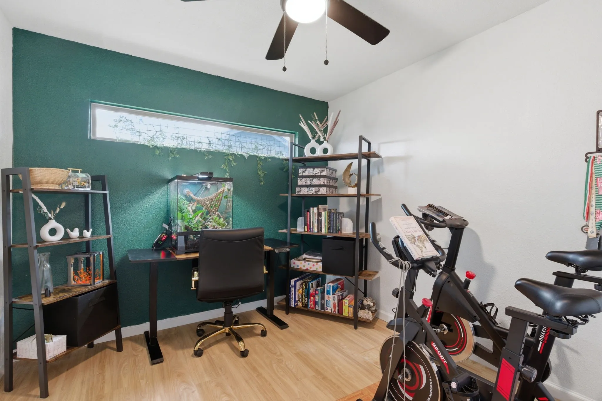Office space featuring light wood-style floors and a ceiling fan
