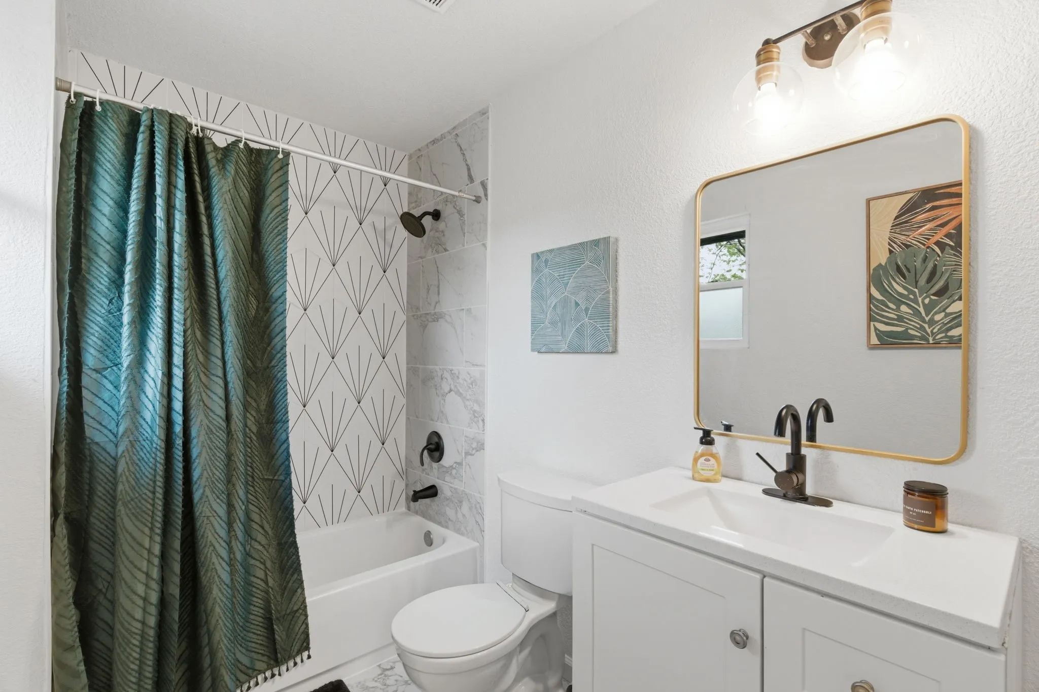 Full bath featuring shower / tub combo and vanity